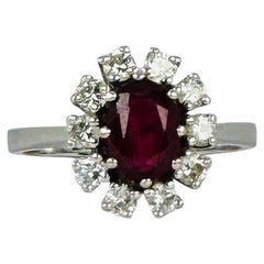 14k entourage white gold ring with oval ruby with 10 diamonds 0.50 carat VSI