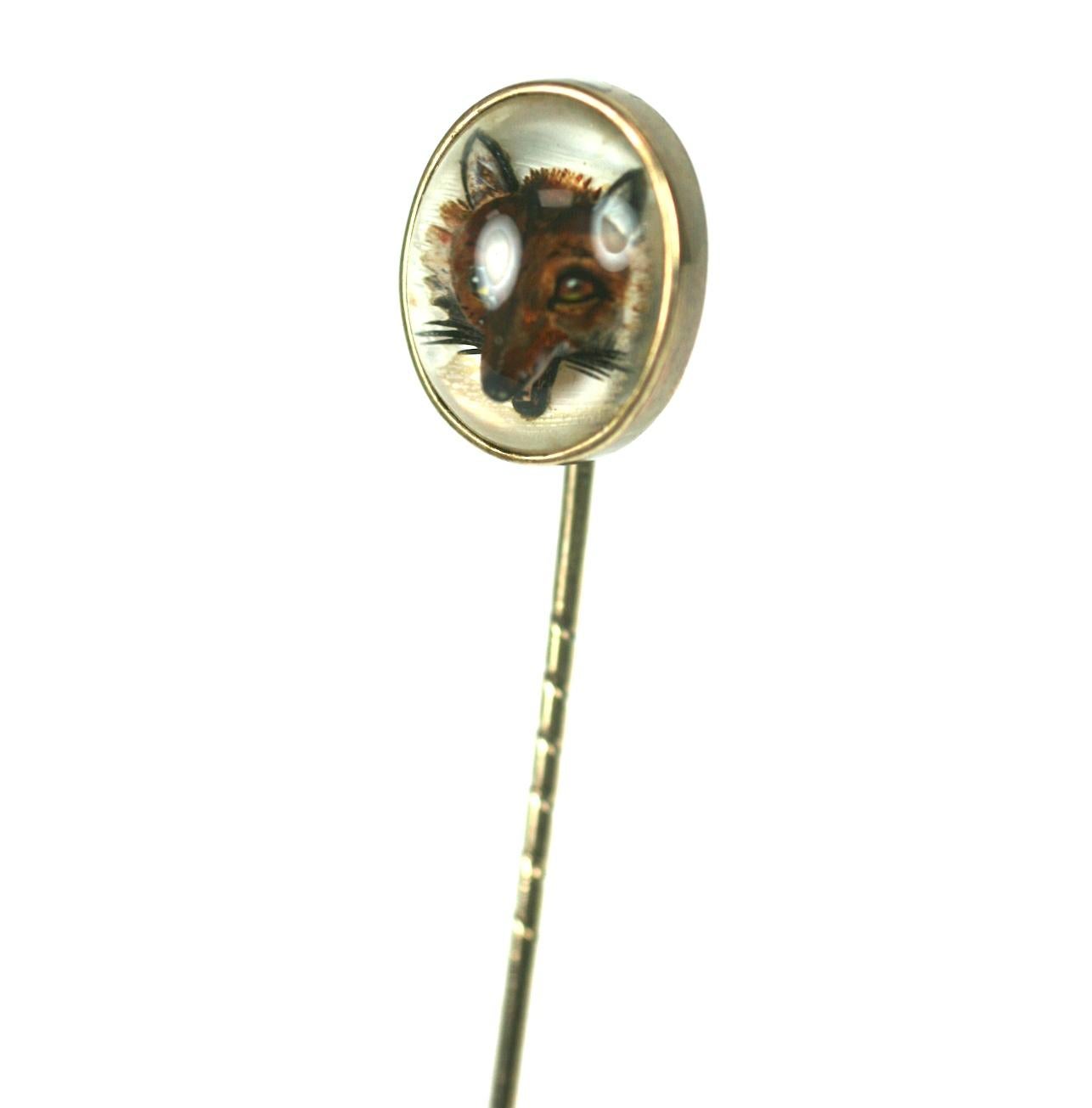 Art Deco Period Essex Crystal Fox Stickpin set in 14k gold. Wonderful carving and reverse painting on the fox. Mother of pearl backing. 1930's USA. 
3