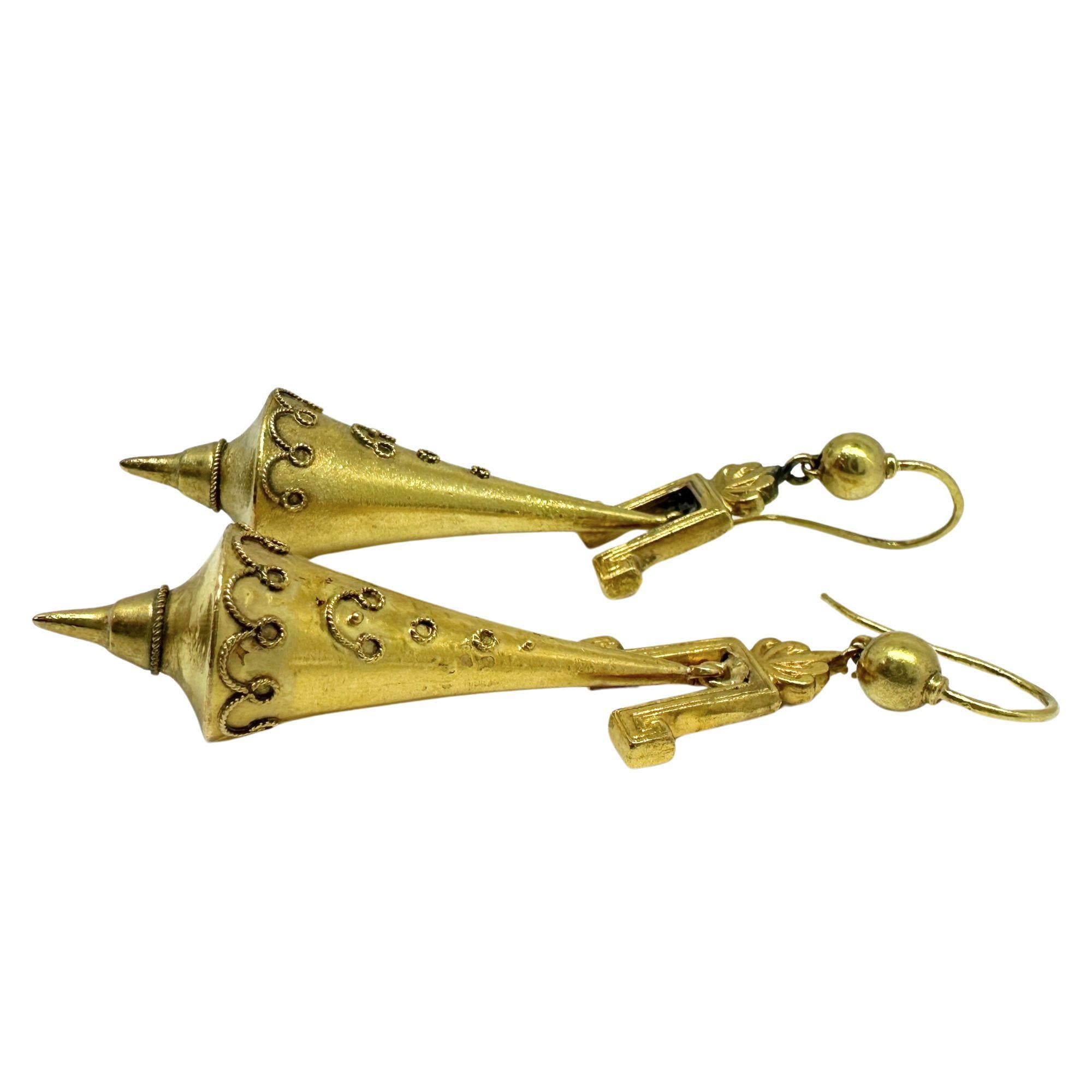 These beautiful 14k Etruscan Revival Gold Drop Earrings are a testament to Victorian jewelry design. In good condition, they feature a classic yellow gold metal that adds elegance and sophistication to any outfit. With a length of 2.5 inches and a