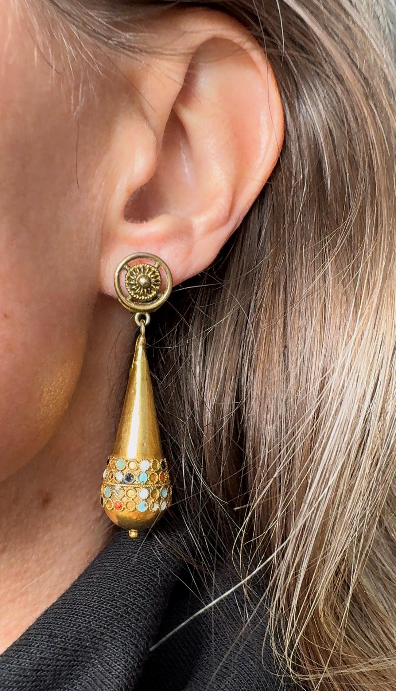 Playful yet sophisticated, these graceful Etruscan revival drop earrings are adorned with torsade details and vibrant enamel dots that catch your eye with every movement. 

 

Measurements: 2 1/8