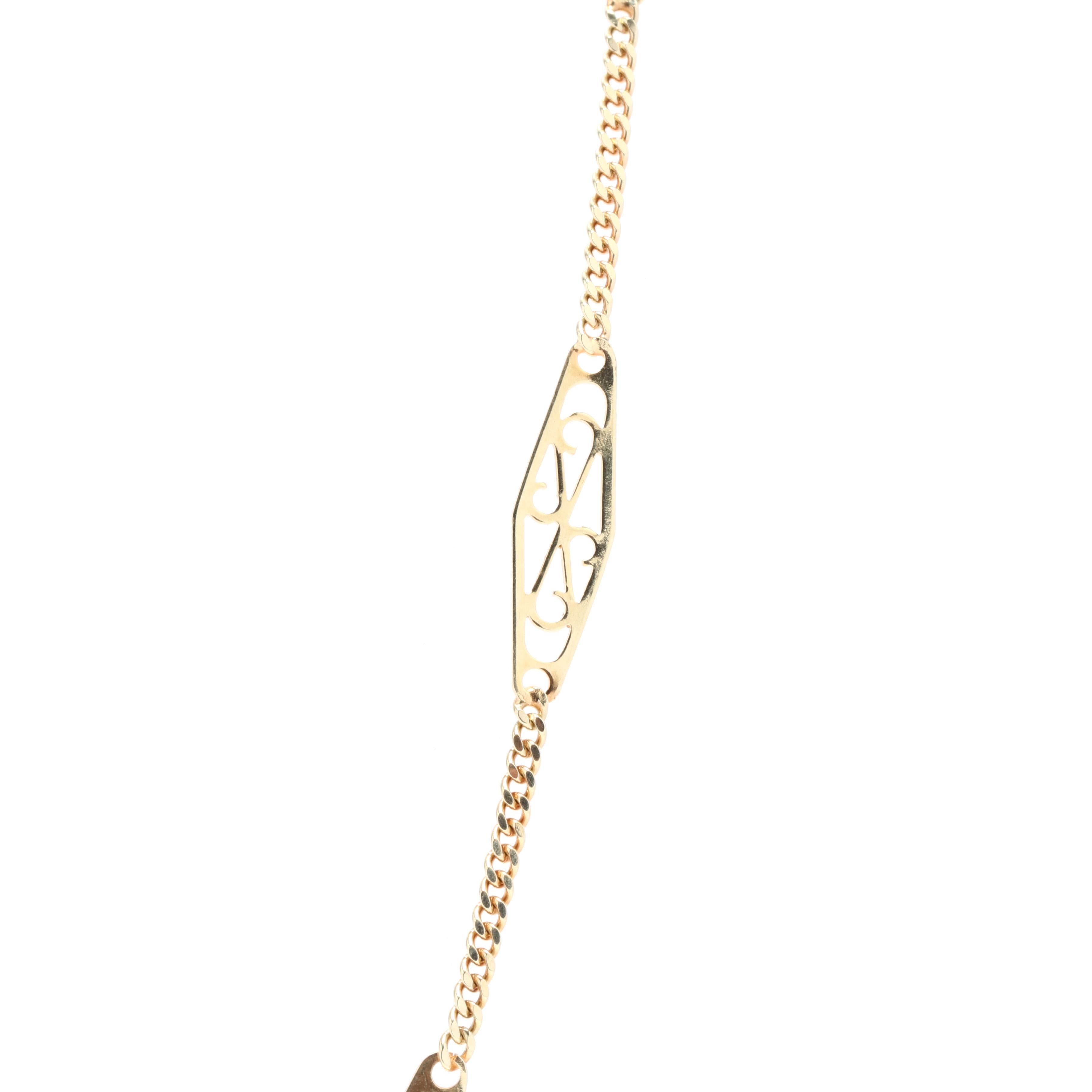 A vintage 14 karat yellow gold filigree and curb link chain. This chain features thirteen filigree lozenge links insterspersed on a curb link chain with a spring ring clasp.



Length: 20 in.



Width: 5.65 mm



Weight: 4.3 dwts.