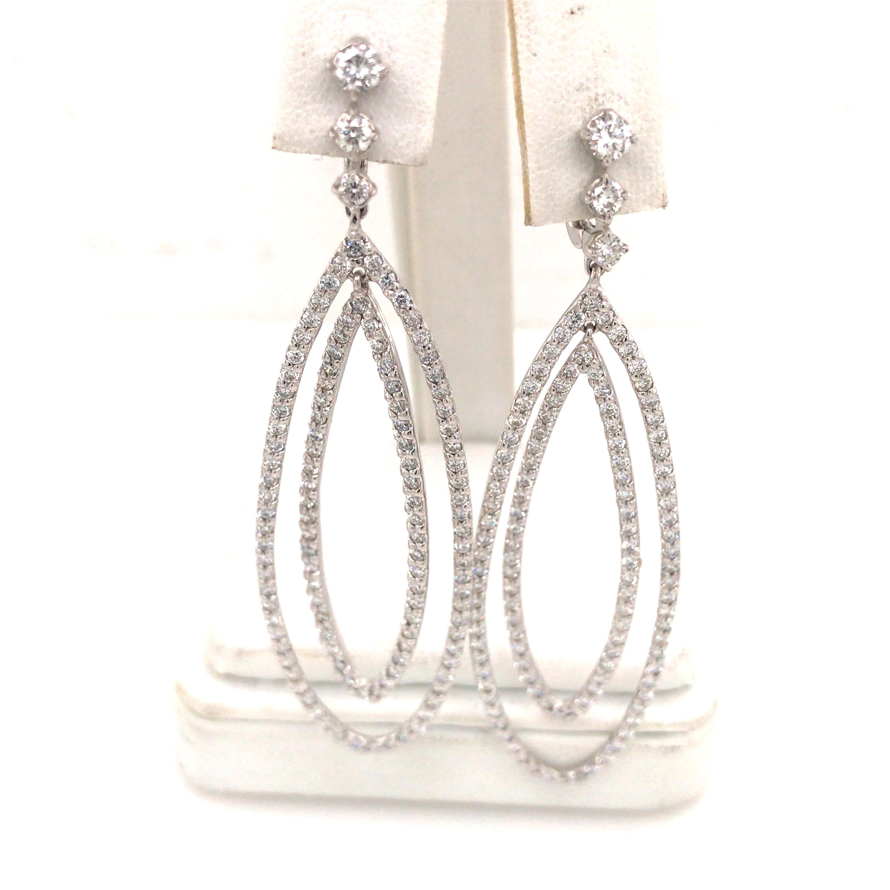 Geometric Diamond Drop Earrings in 14K White Gold expertly set with  Round Brilliant Cut diamonds weighing 4.21 carat total weight, G-H in color and VS in clarity.  The Earrings measure 2 3/4 inches in length and 3/4 inch in width at the widest