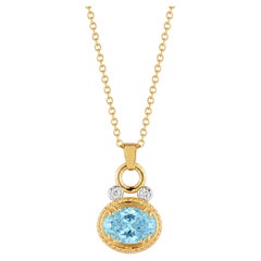 14K Gold 0.05 ct. tw. Dia. & 3.0CT 8x10mm Blue Topaz Oval Pendant Slide