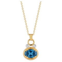 14K Gold 0.05 ct. tw. Dia. & 3.0CT 8x10mm London Blue Oval Pendant Slide