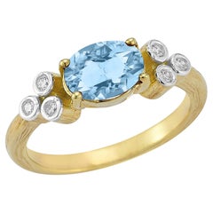 Oro 14K 0,09 ct. tw. Anello cocktail con diamante e topazio blu da 1.5 carati