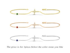 Bracelet croix en or 14 carats avec diamant 0,13 carat et rubis, émeraude et saphir