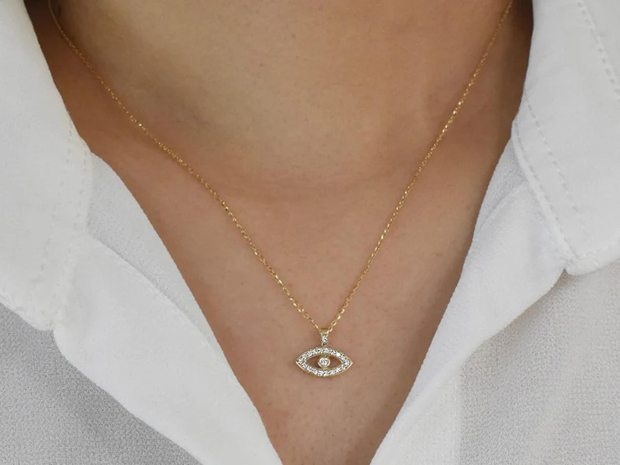 The beautiful little Evil Eye pendant is made from 14k solid gold adorned with natural white round cut diamonds. This necklace is designed to protect the wearer from the negativity and evil around. Perfect for wearing by itself for a minimal