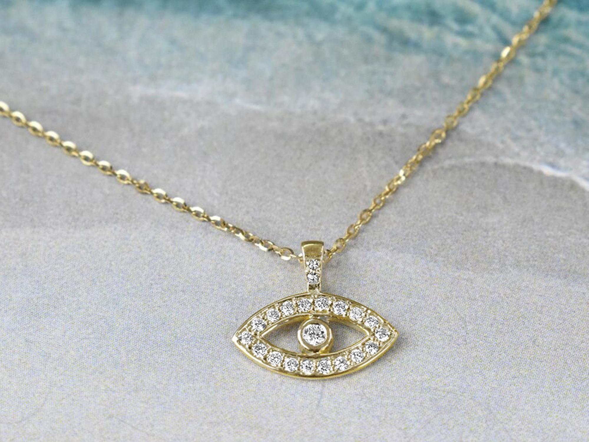 Egyptian Revival 14k Gold 0.14 Carat Diamond Minimalist Evil Eye Protection Necklace For Sale