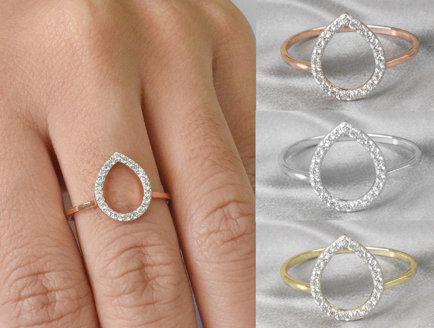 For Sale:  14k Gold 0.18 Carat Diamond Pear shape open Ring 5