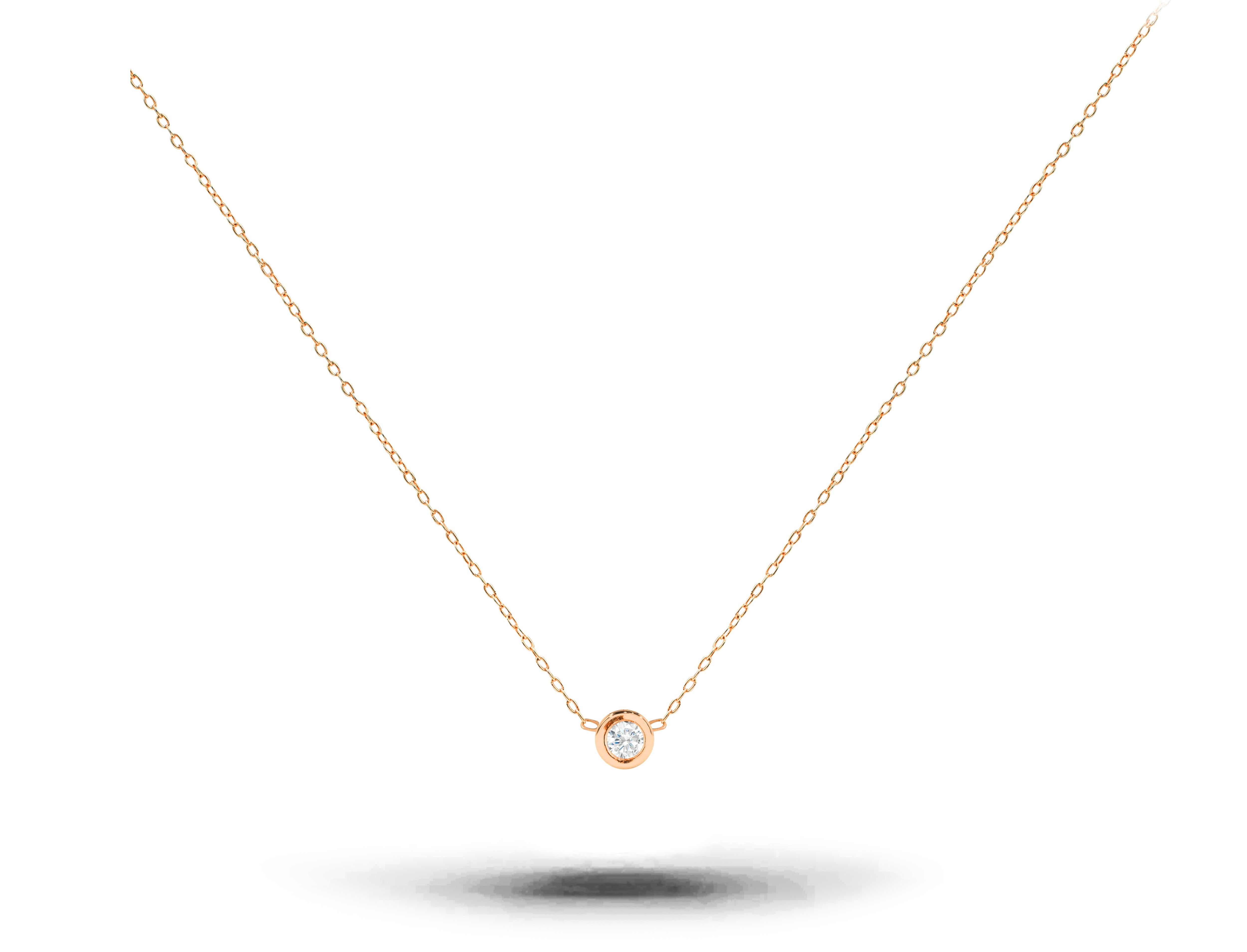 A brilliant white sparkly natural solitaire diamond necklace in a bezel set comes with a thin gold chain and is a perfect choice for everyday wear. Also called a floating diamond necklace, it would be a perfect gift at any occasion to celebrate her