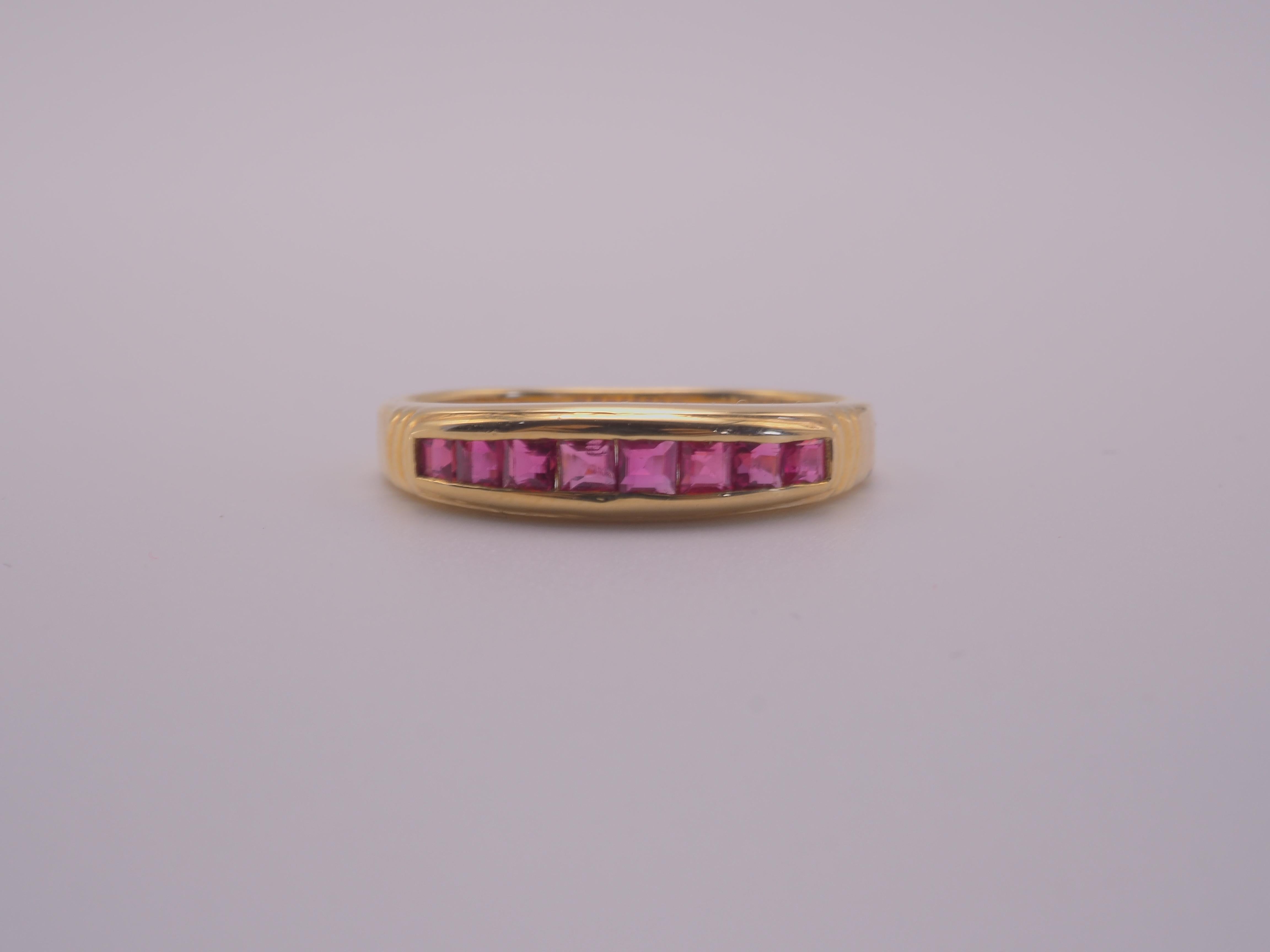 A gorgeous luxury Neo-vintage band ring that is both suitable for all sexes. This ring has one row of 8 beautiful, squared Thai rubies channeled nicely into the band. The square cut rubies vary in sizes and have a beautiful pinkish red hue. This