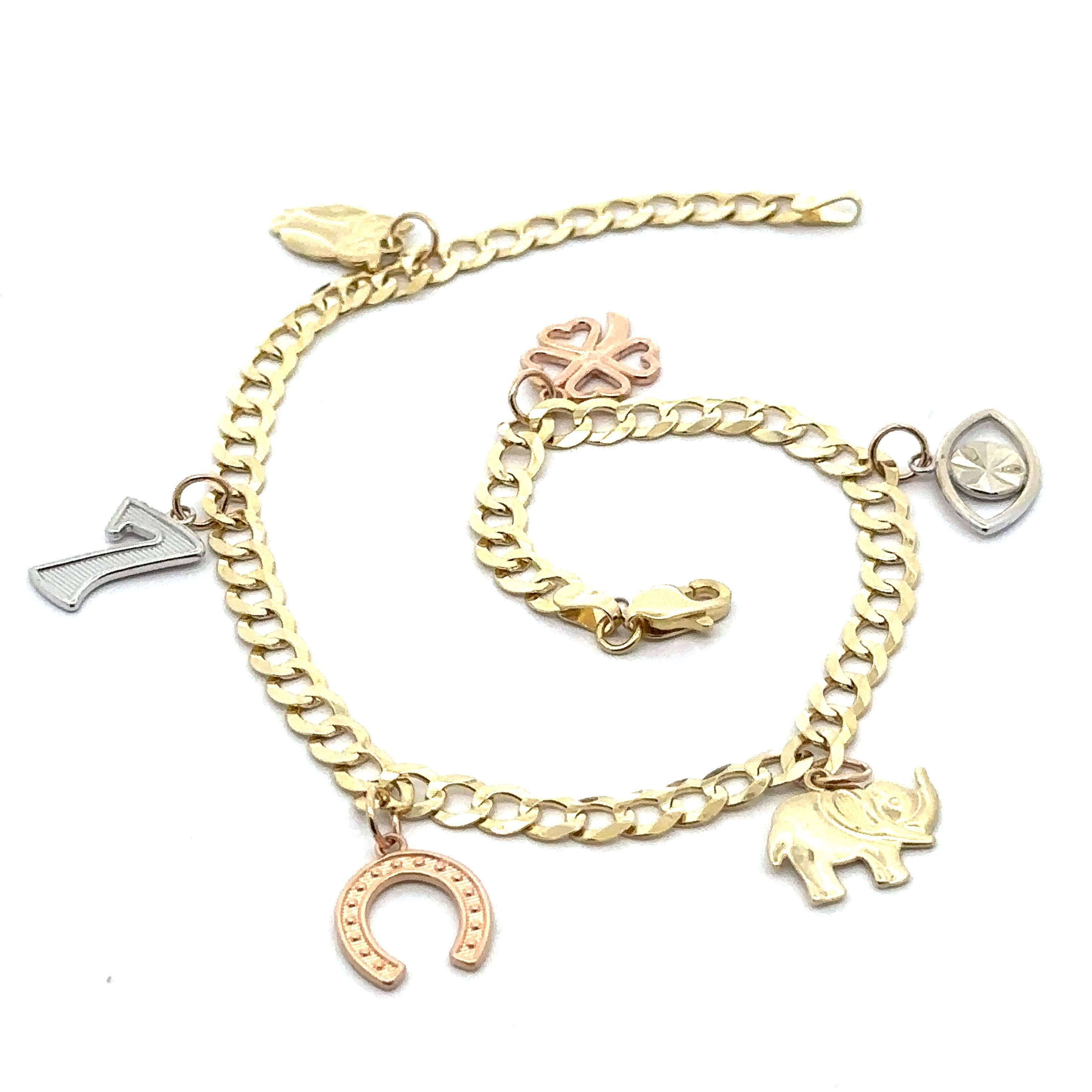 Tobillera con dije de 7 de la suerte, búho, herradura, ojo, elefante y trébol de cuatro hojas, tricolor y 14k

Material: Oro amarillo, blanco y rosa macizo de 14 quilates
Peso: 11 gramos
Dimensiones del dije: 13,2x8mm (búho)- 12,6x8,8mm (7 de la