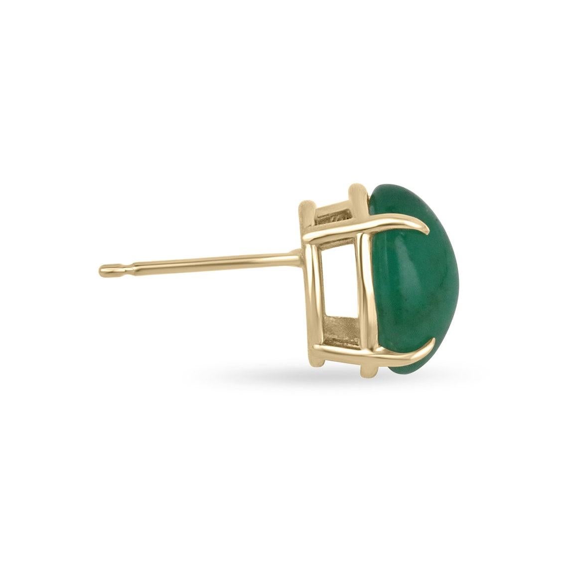 Featured here is a beautiful set of large rare oval cut cabochon emerald studs in fine 14K yellow gold. Displayed are rich dark forest green emeralds with very good transparency, accented by a simple four-prong claw gold mount, allowing for the