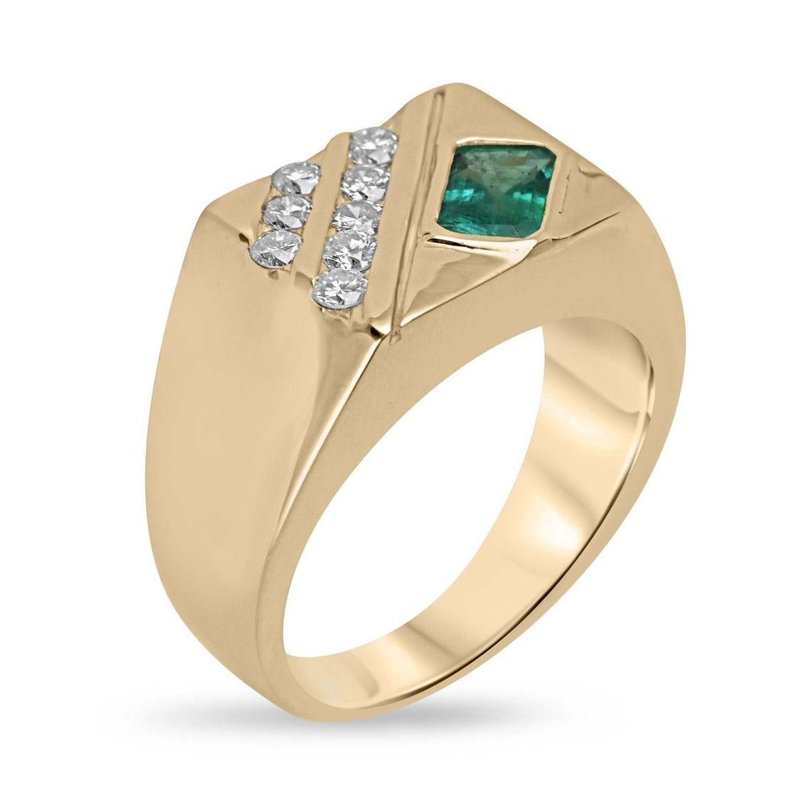 Elevate your style with our distinguished Men's Emerald and Diamond Ring, a bold and captivating statement piece that embodies sophistication and strength. Featuring an off-set emerald cut emerald from Zambia, bezel-set to perfection and showcasing