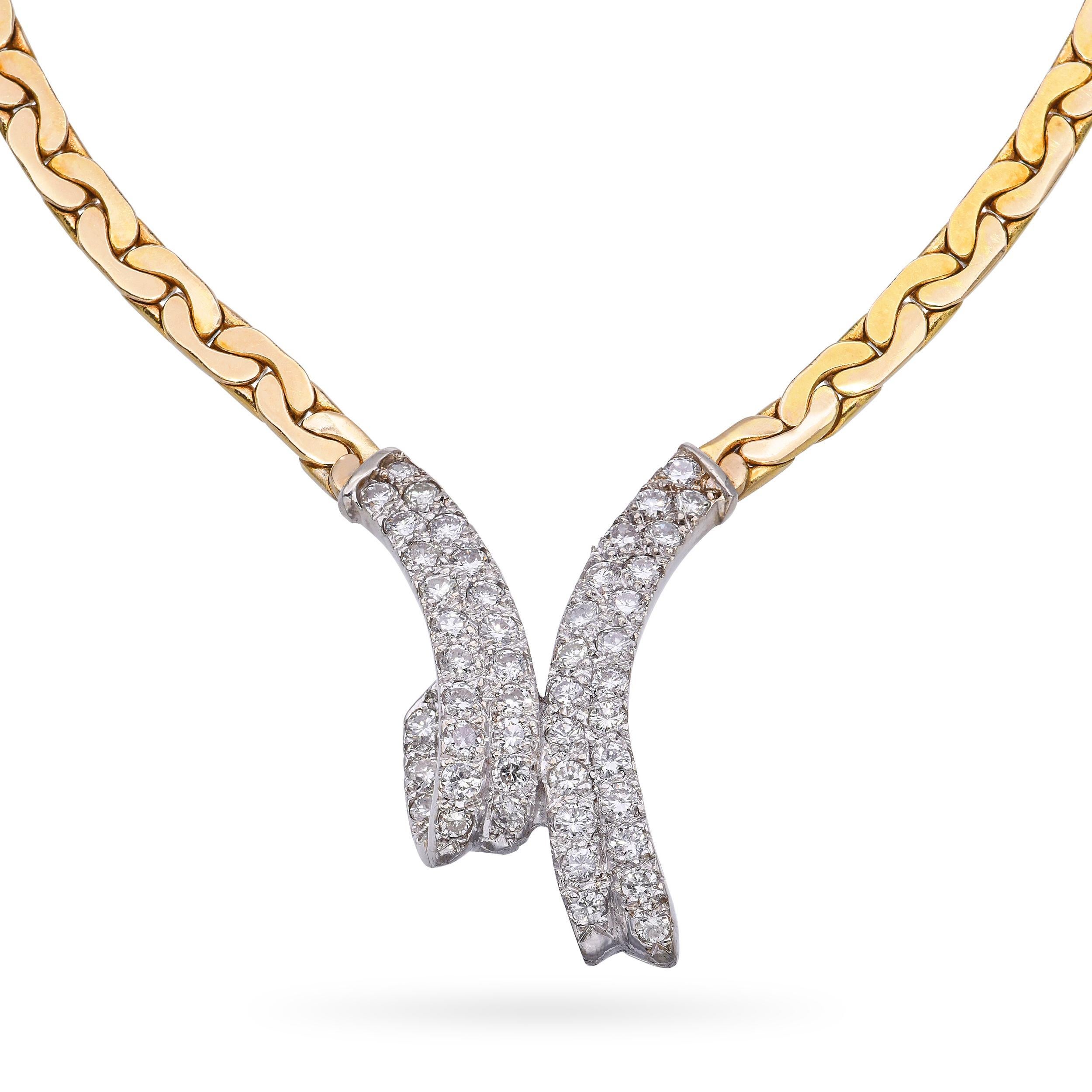 This elegant vintage necklace is crafted in 14k yellow and white gold, featuring a striking V-shaped design adorned with shimmering pavé-set diamonds. The two-tone gold enhances the brilliance of the diamonds, creating a sophisticated contrast and