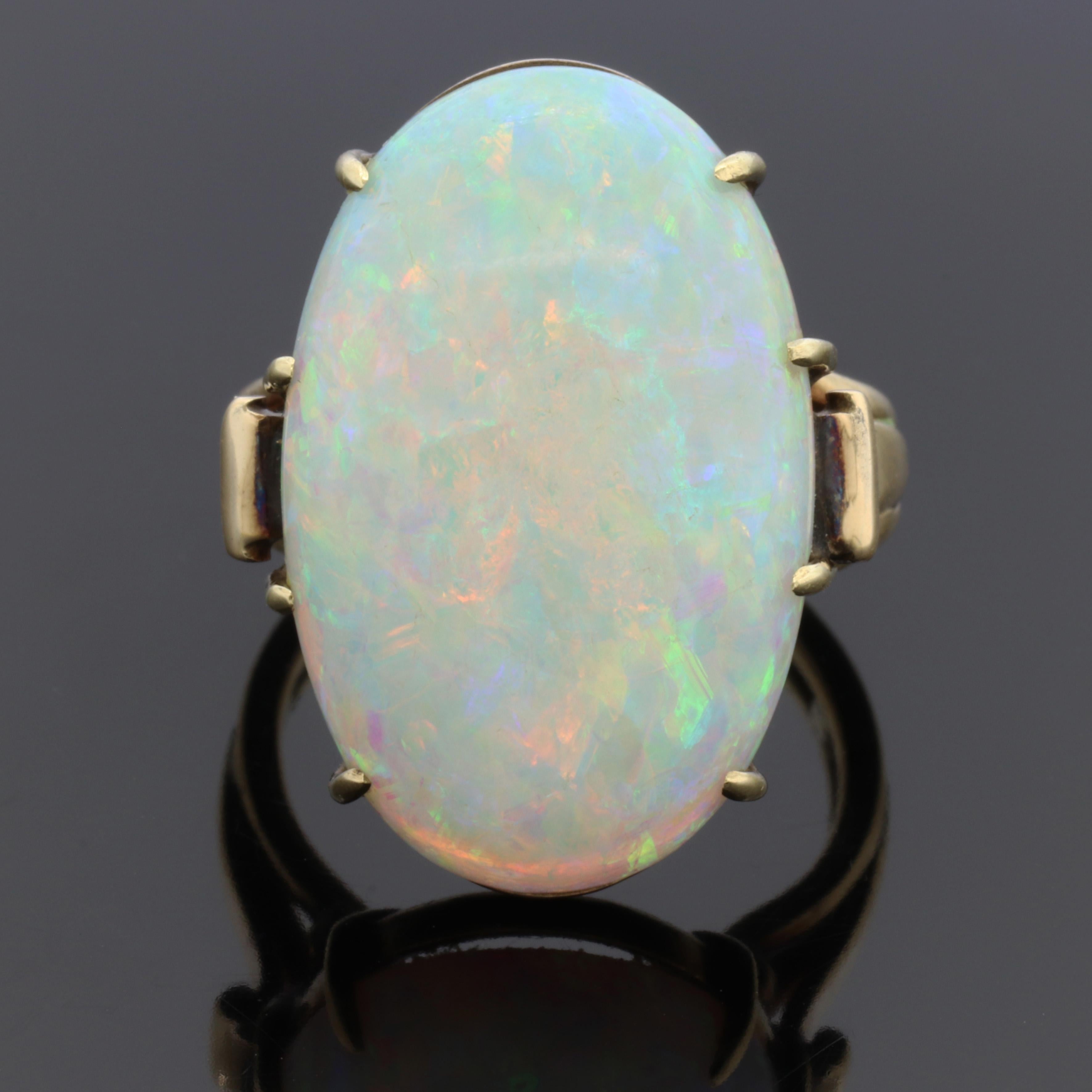 This is a fabulous old opal ring is really a showstopper in person, it is one of those Opals that has bold eye catching presence when worn and is a sea of green and pink fire. 
Pictures do not do this piece justice.
This is not a doublet or a
