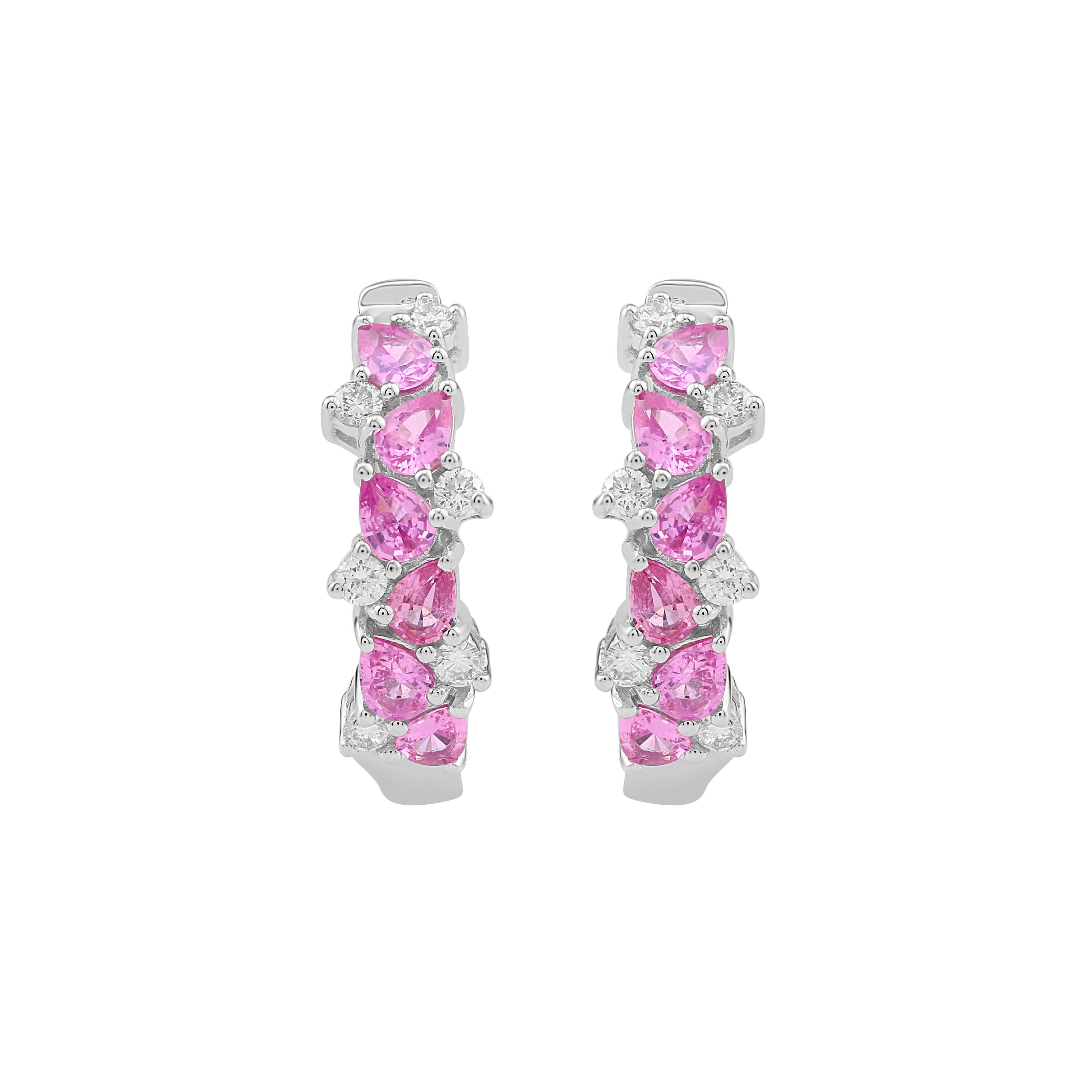 Crafted in 14k White Gold, these Gemistry hoop earrings feature prong set pear shaped pink sapphire gemstones set with round prong set white diamonds down the front of the hoop. Hinged hoop snap bar closure.
Please follow the Luxury Jewels