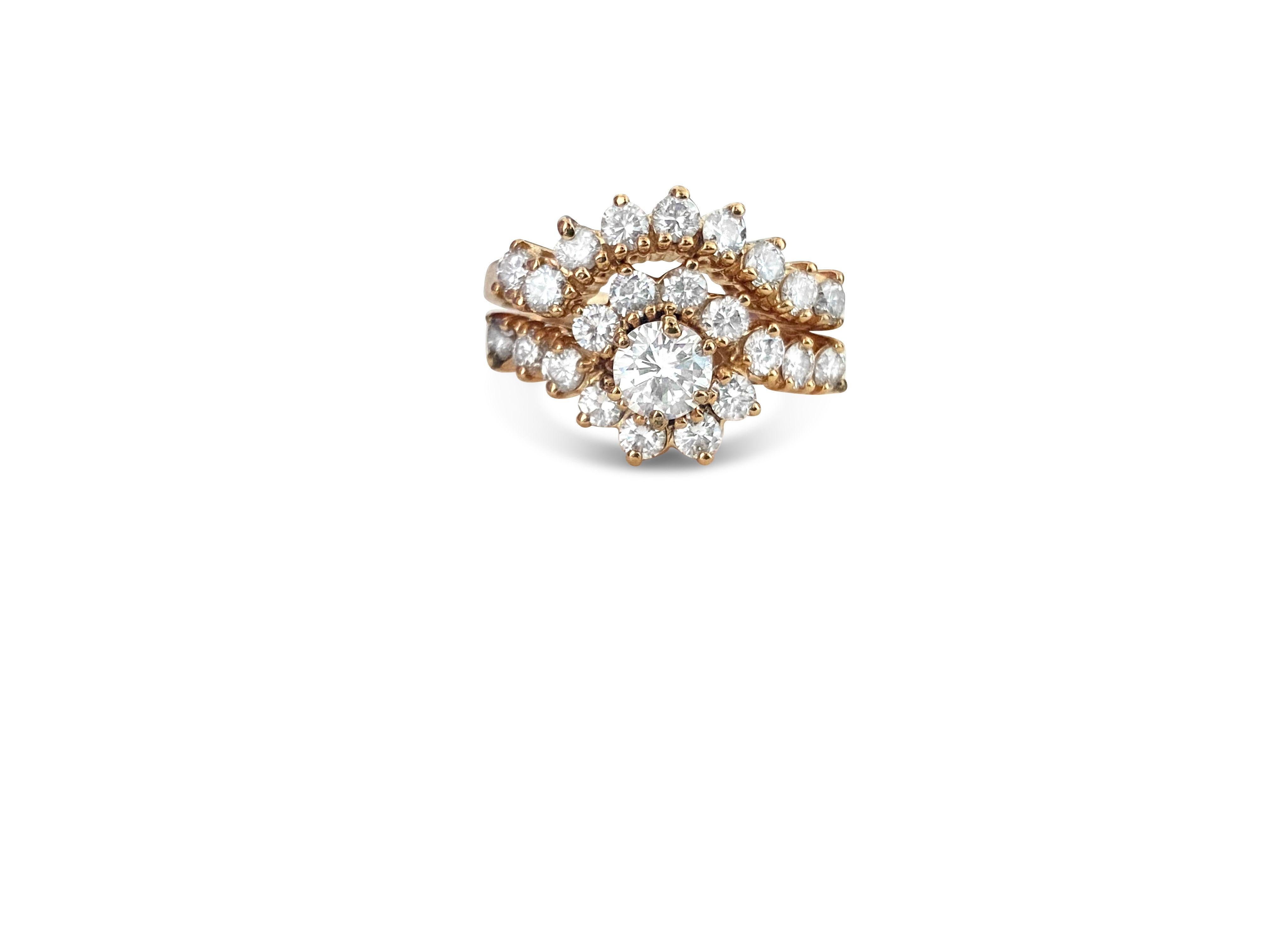 Dieser bezaubernde Ring aus luxuriösem 14-karätigem Gelbgold besteht aus einem 0,70 Karat schweren Diamanten mit der Farbe G und der Reinheit SI2, der von seitlichen Diamanten von insgesamt 1,30 Karat mit der Farbe G und der Reinheit VS-SI