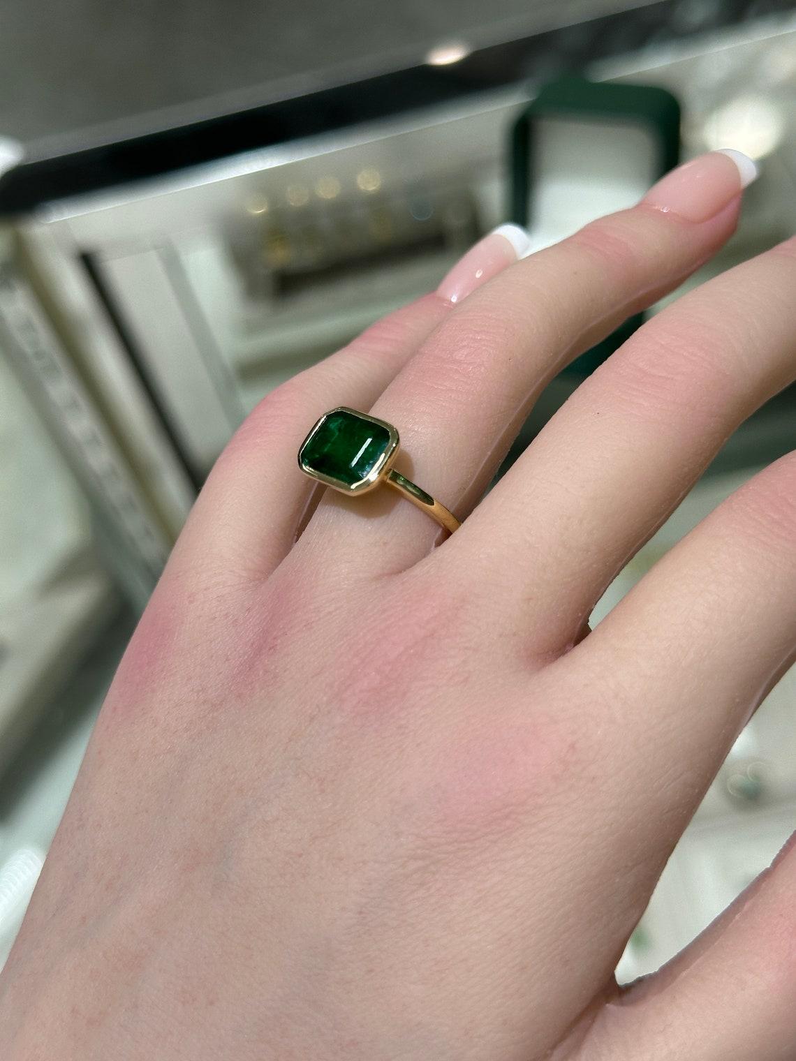 Modern 14K Gold 2.90cts Bezel Set Emerald Solitaire Ring, East-West Emerald Cut Design