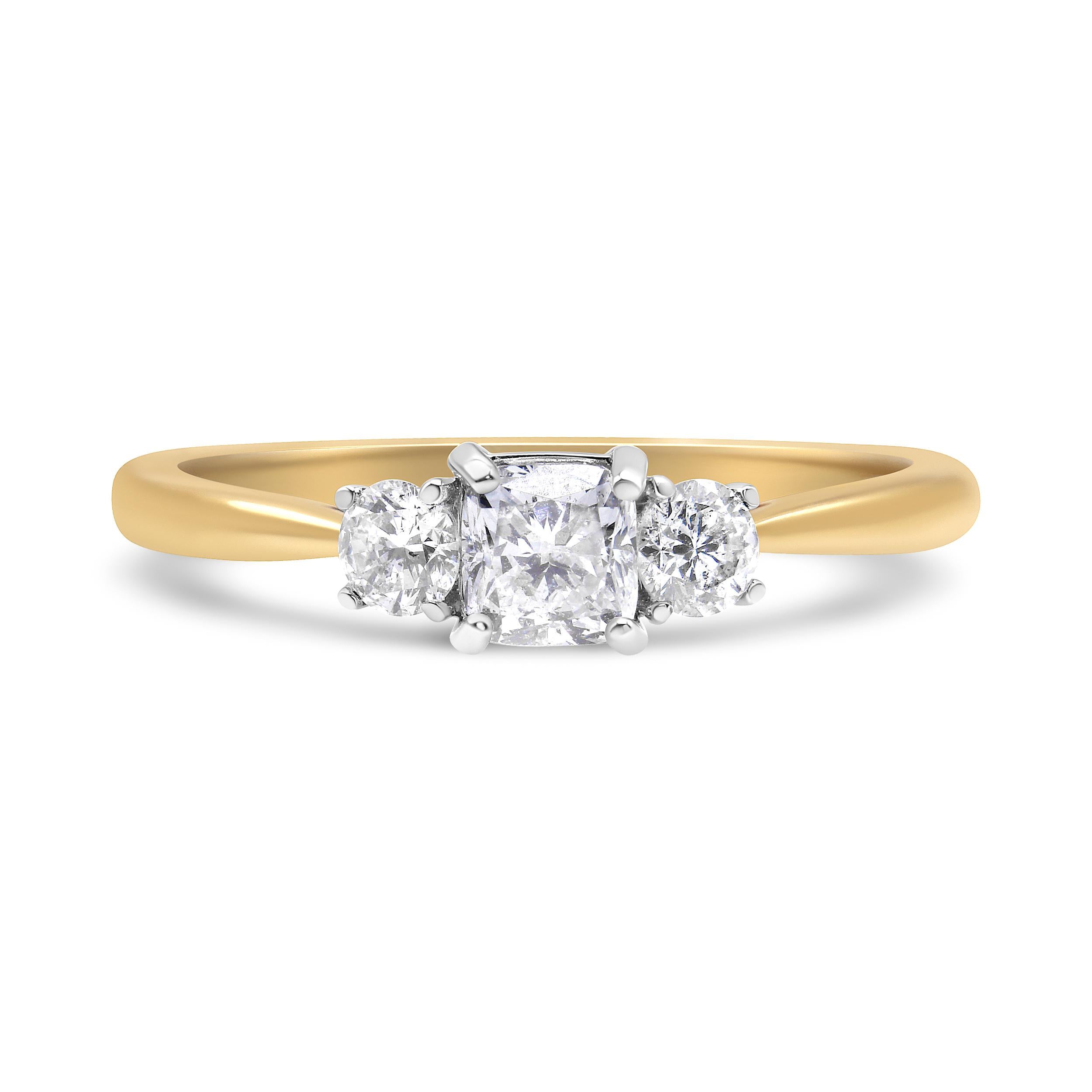 Ask for her hand with this chic engagement ring inspired by the original Bostonian 3 stone engagement ring. Crafted in from warm 14K yellow gold, this sparkling look showcases a .45 ct. Cushion-cut diamond flanked by two 1/6 ct. round-cut diamonds.