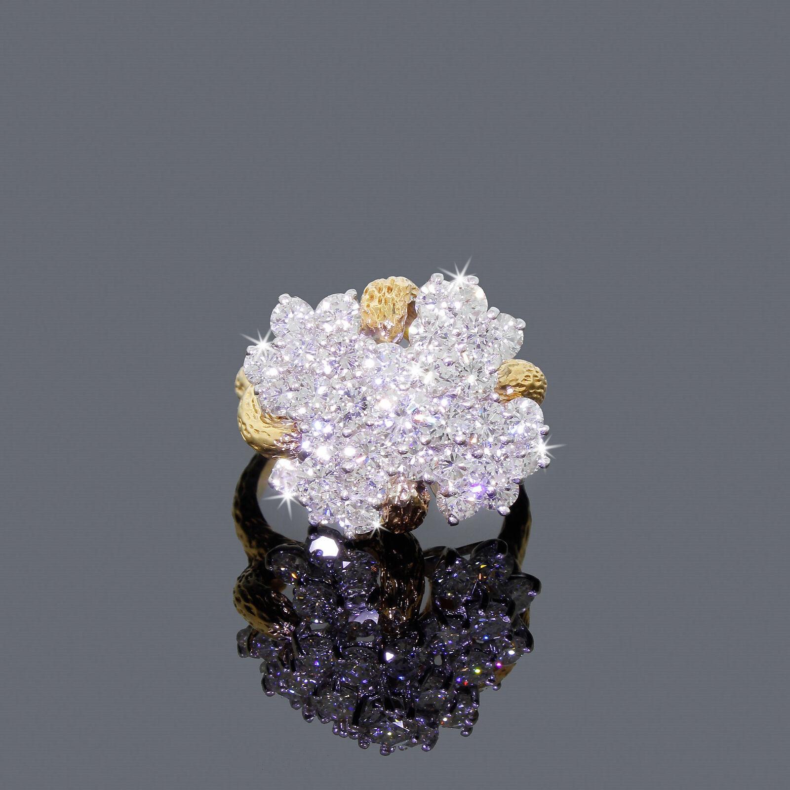 This is one of those rings that the moment you see it? It will be a wow moment.
There are 5 tiers of shining diamonds that sit 0.55 of an inch tall from the finger when worn.
The diamonds are BEAUTIFUL, bright and clean with a great color - now we