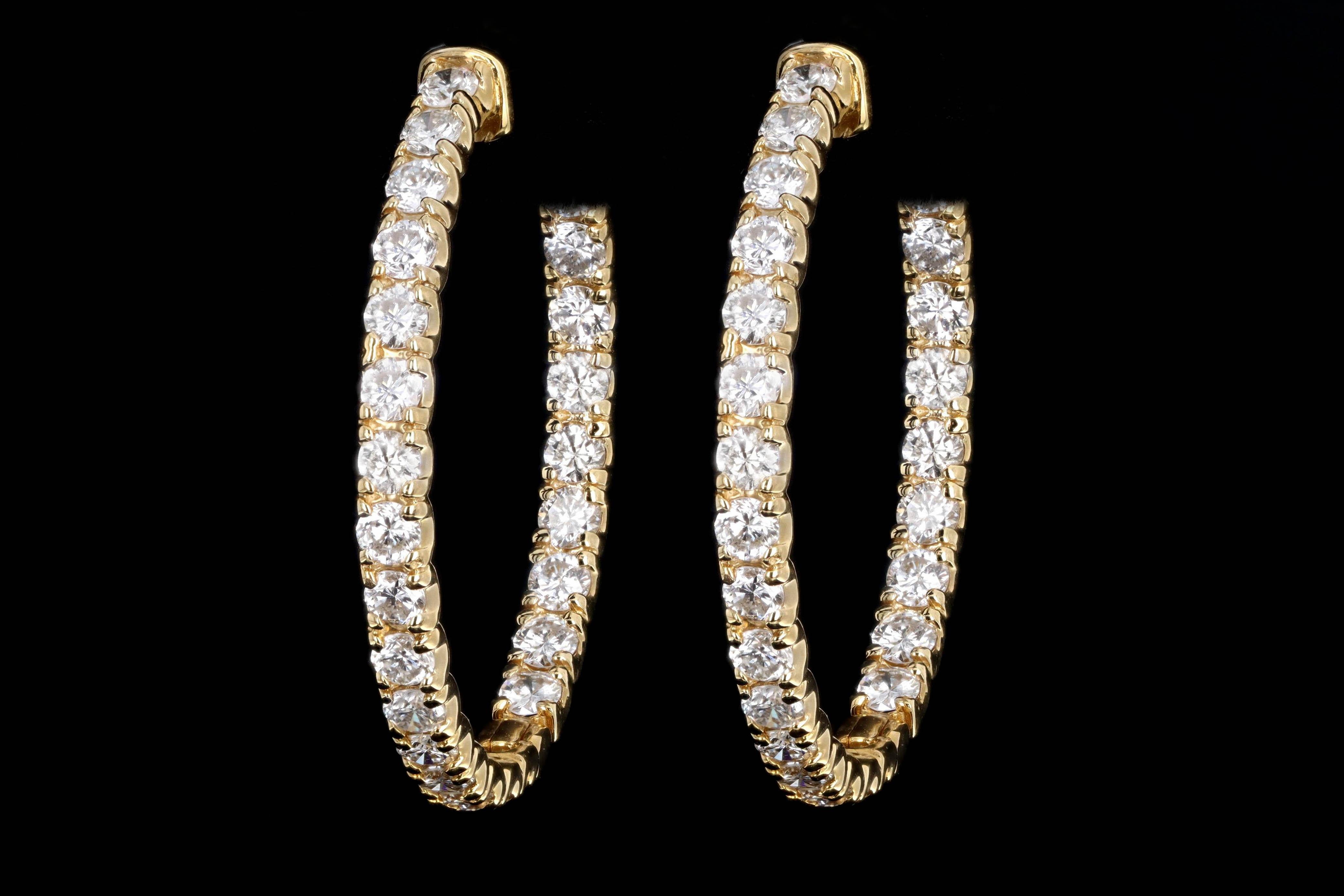 Era: New

Composition: 14K Yellow Gold

Primary Stone: Fifty Two Round Brilliant Cut Diamonds

Total Carat Weight: Approximately 4.61 Carats 

Color/Clarity: G/H - SI1/2

Earring Diameter: 1.25 Inches

Earring Weight: 11.6 Grams

Item Barcode: 239022