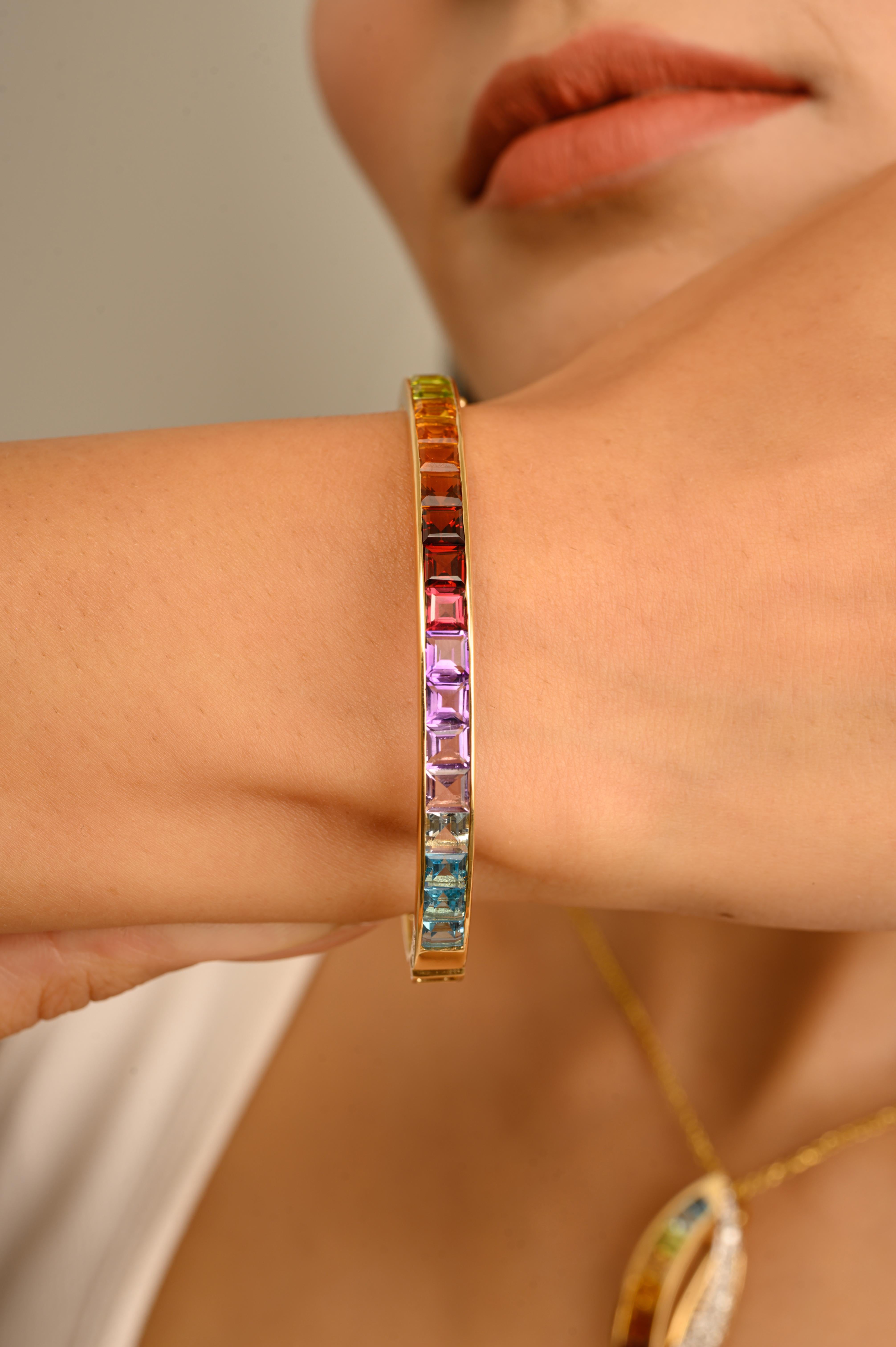 Bracciale dell'orgoglio moderno in oro giallo 14 carati con gemma multicolore incastonata a canale da 4 mm.

Scopri l'incanto del bracciale Multicolor Rainbow Channel Set, una vera incarnazione di vibrante raffinatezza che celebra la miriade di