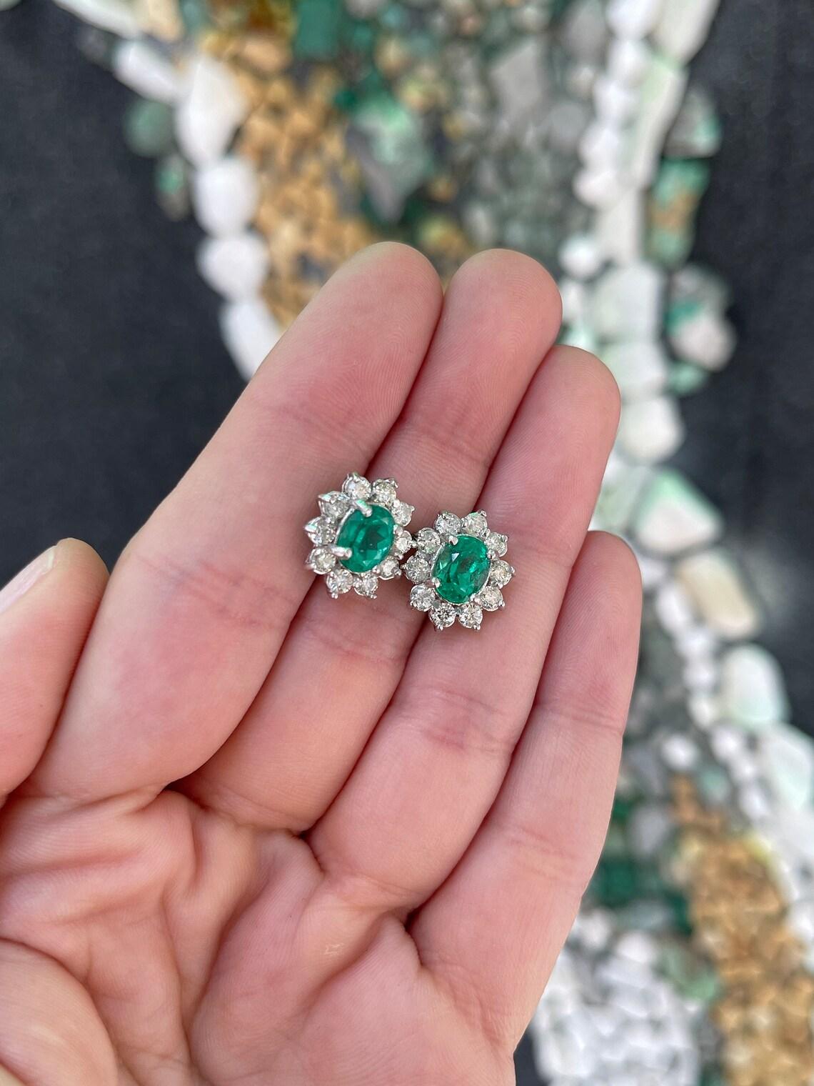 Modern 14K Gold 5.0tcw Rich Green Colombian Emerald Oval & Diamond Halo Stud Earrings For Sale