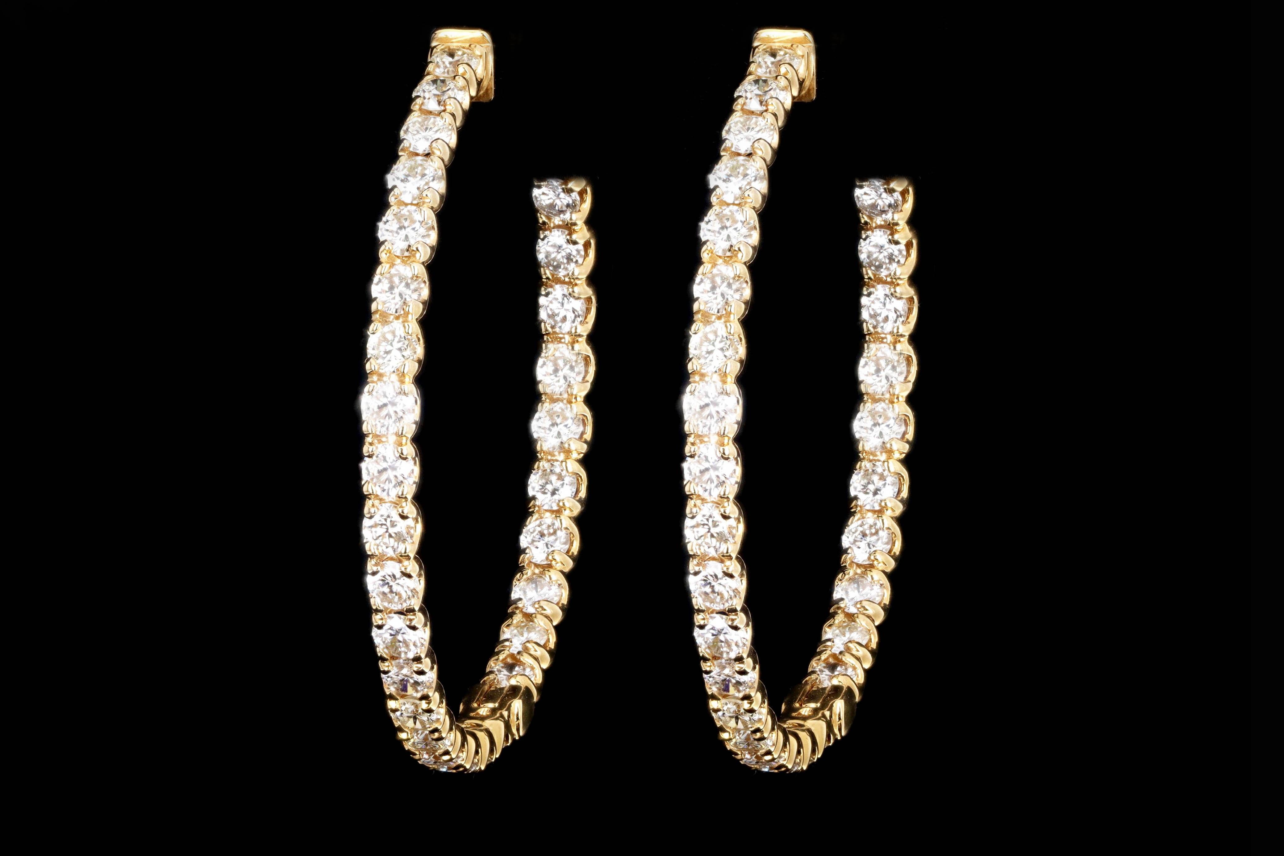Era: New

Composition: 14K Yellow Gold

Primary Stone: Sixty Two Round Brilliant Cut Diamonds

Total Carat Weight: Approximately 5.40 Carats 

Color/Clarity: G/H - SI1/2

Earring Diameter: 1.5 Inches

Earring Weight: 12.5 Grams

Item Barcode: 128923