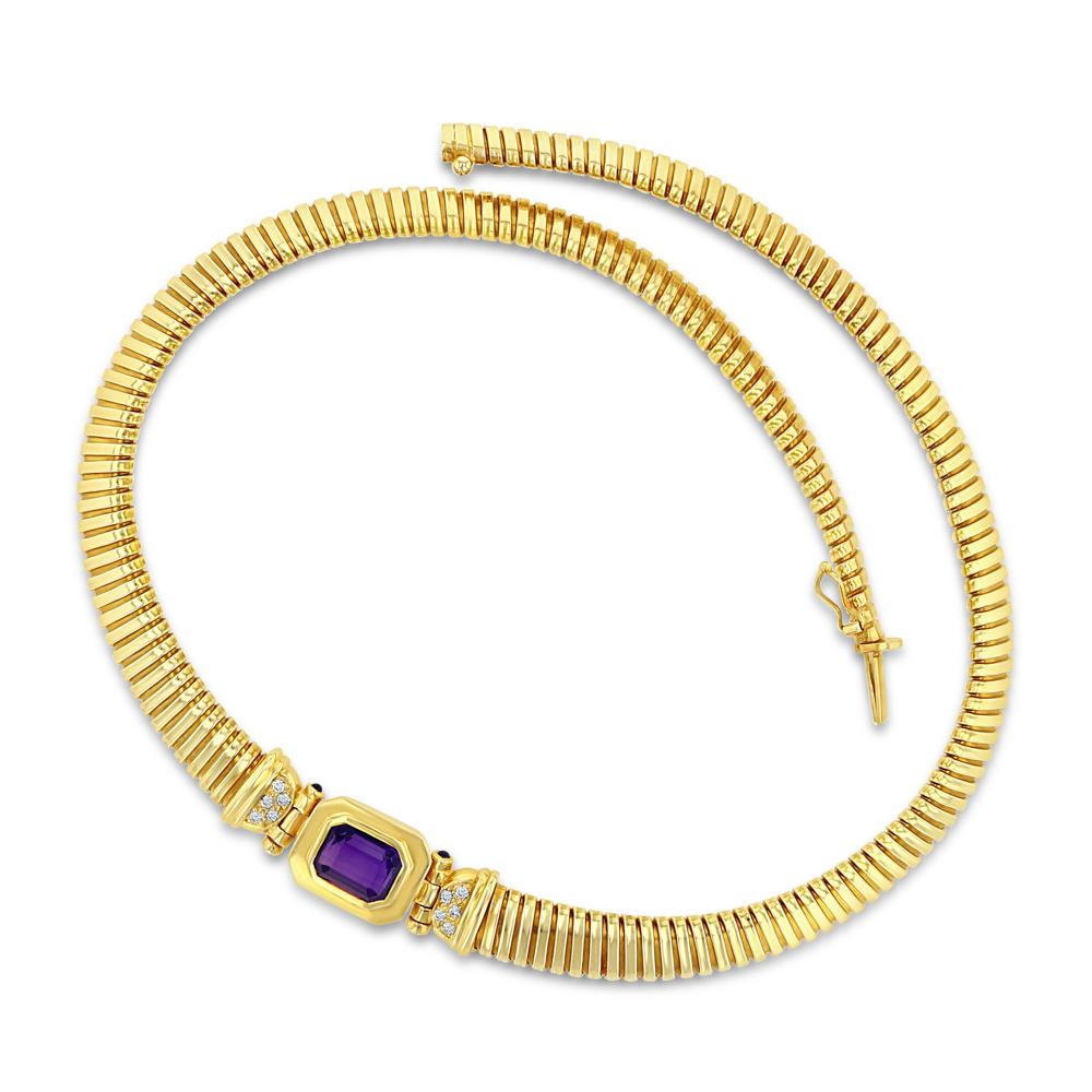 This retro art deco piece is a unique beauty. Its a 14k yellow gold collar chain with a bezel set amethyst in the center, the amethyst is complimented with a cluster of five diamonds on each side, and a sapphire bezel set at each end of the