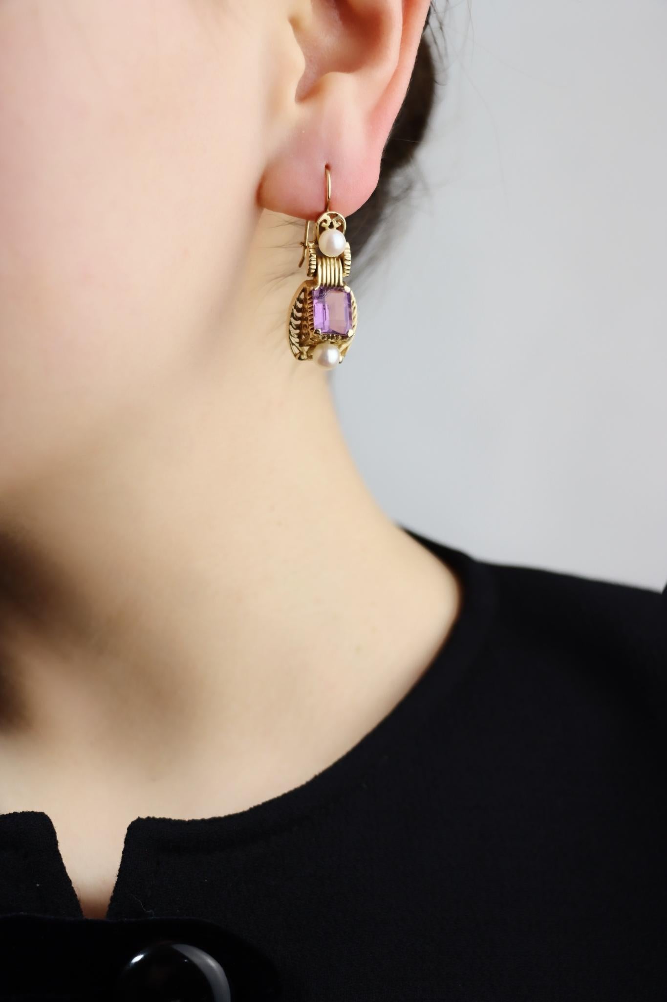 14K Gold Amethyst Pearl Earring

Approximate Dimensions:
3.5 cm (Length) 
1.3 cm (Width)
9.65 mm x 7.41 mm - 7.22 mm (Amethyst)
9.6 grams in weight.
