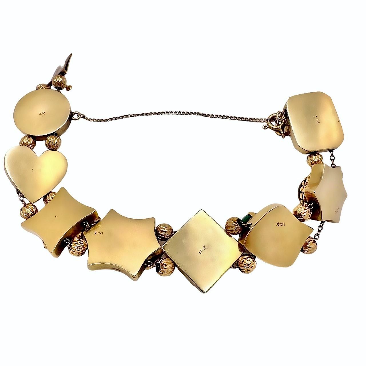 This Mid-20th century slide bracelet is from a genre of similar pieces, all derived and created as a tribute to slides which were primarily used in Victorian period ladies necklaces. It is crafted from 14k gold and is liberally set with assorted