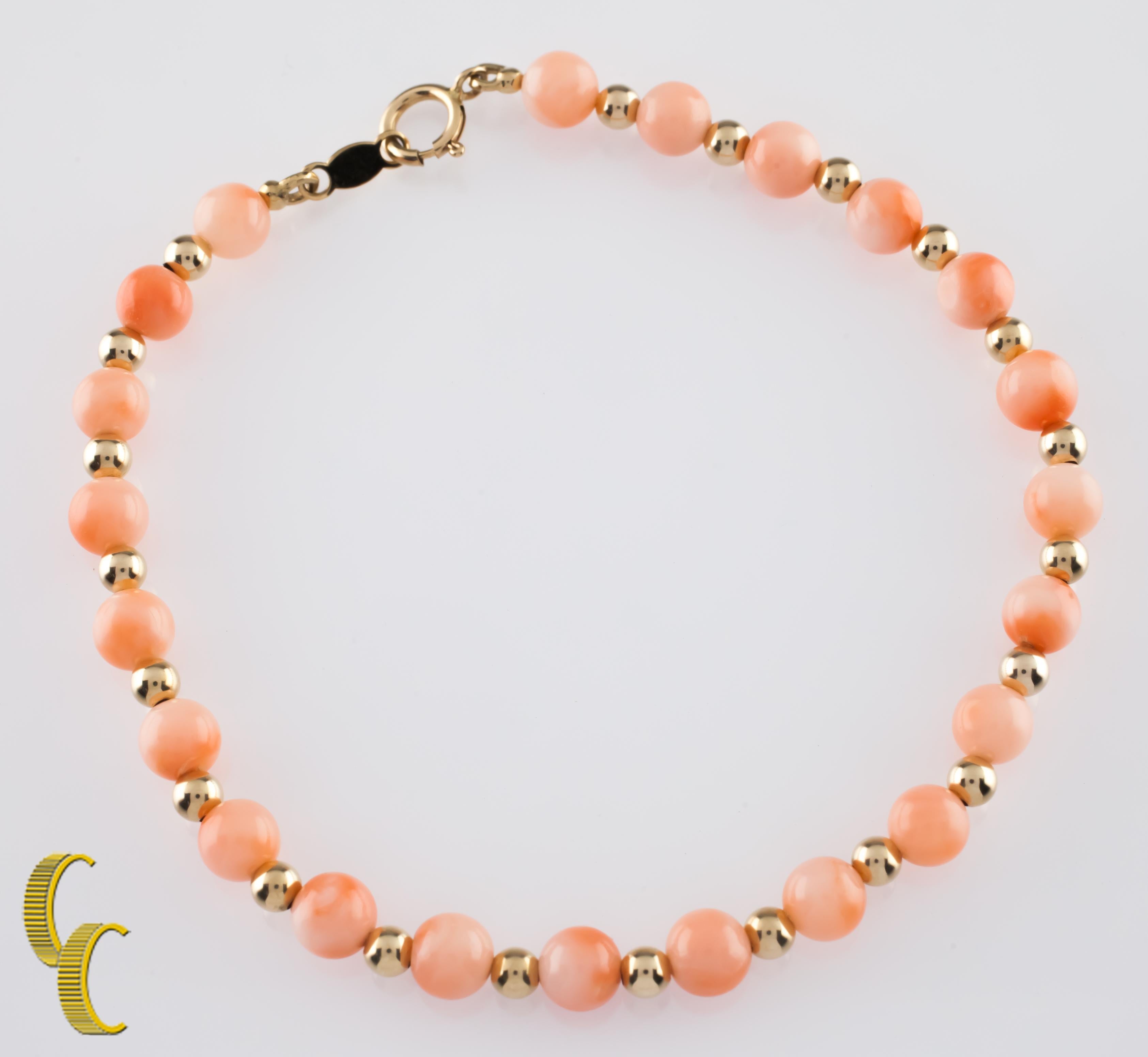 Gorgeous coral beaded bracelet.
Features round coral beads (4-5 mm diameter) interspersed with small gold beads (2 mm diameter).
Length: 6.75 inches.
Metal: 14k yellow gold.
Weight: 4.0 grams.