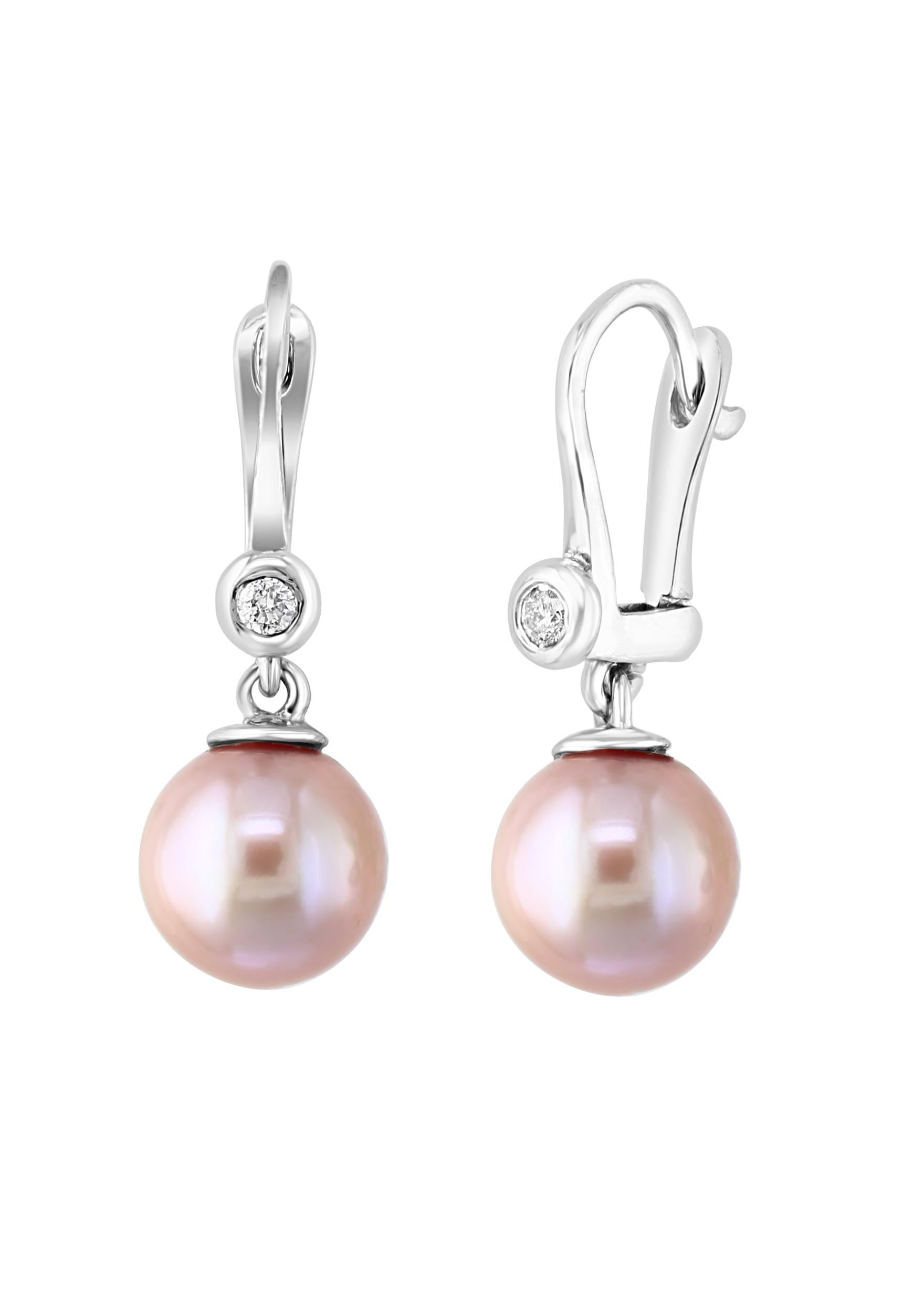 These 14 karat white gold lever-back earrings feature Chinese freshwater, natural color pink round pearls measuring 8-8.5mm sitting beneath 0.06 carats of diamonds. 
EXQUISITELY ELEGANT – New to our Amazon collection, this sophisticated jewelry