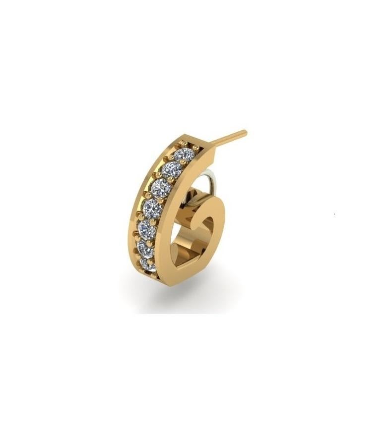 Versatile 14K gold and diamond huggie earring from the LYRA collection! These are great everyday earrings that are designed to allow you to hang your favorite charms (or purchase new ones) without having them slip out of the hoop. This huggie has a