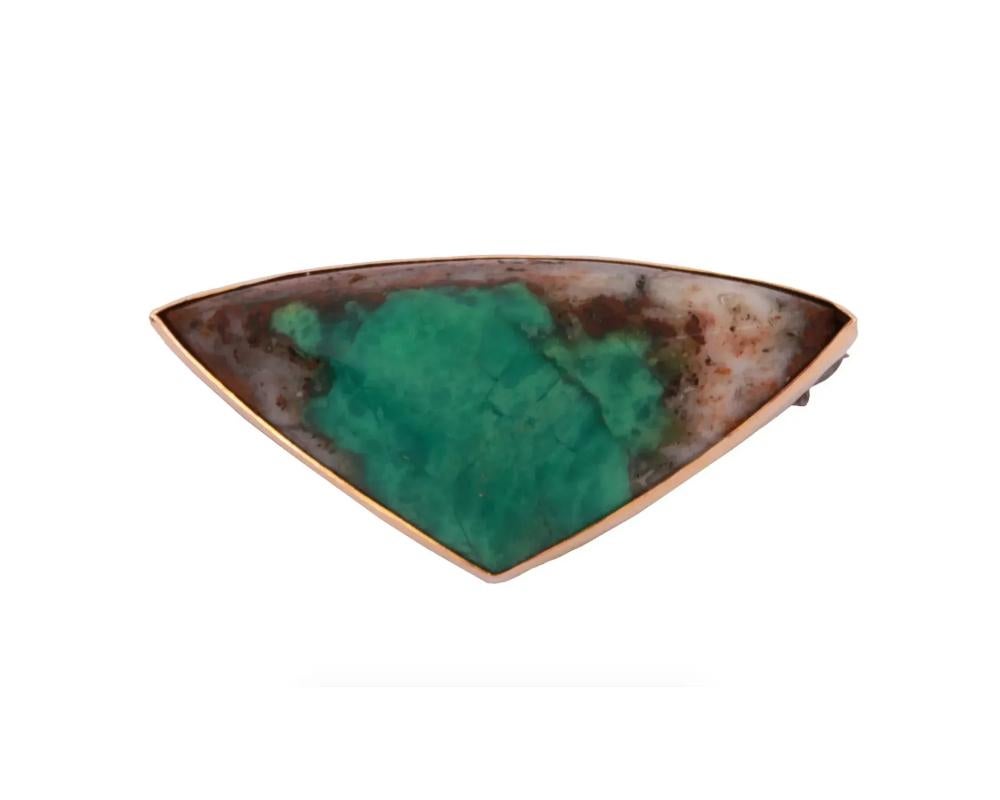 A vintage statement pin brooch. A triangular jasper gemstone is framed with 14K gold. Hallmark 14K is on the backside. Weight: 7.5 grams. Collectible Lapel Jewelry And Fashion Accessories For Women.

Dimensions: 1 1/2 x 3/4 in. All measurements are