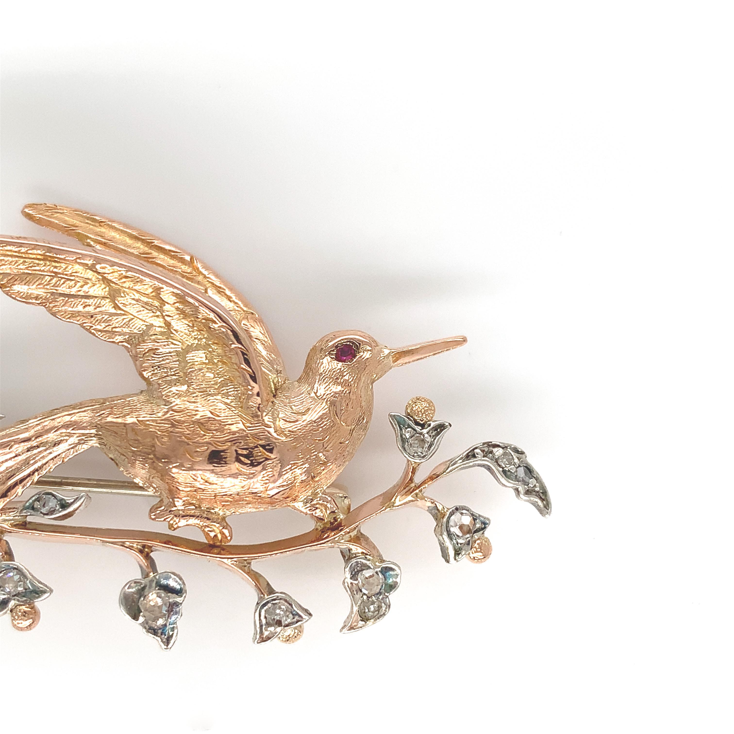14K rosey yellow gold bird pin with early cut diamonds set in silver. The pin measures 2