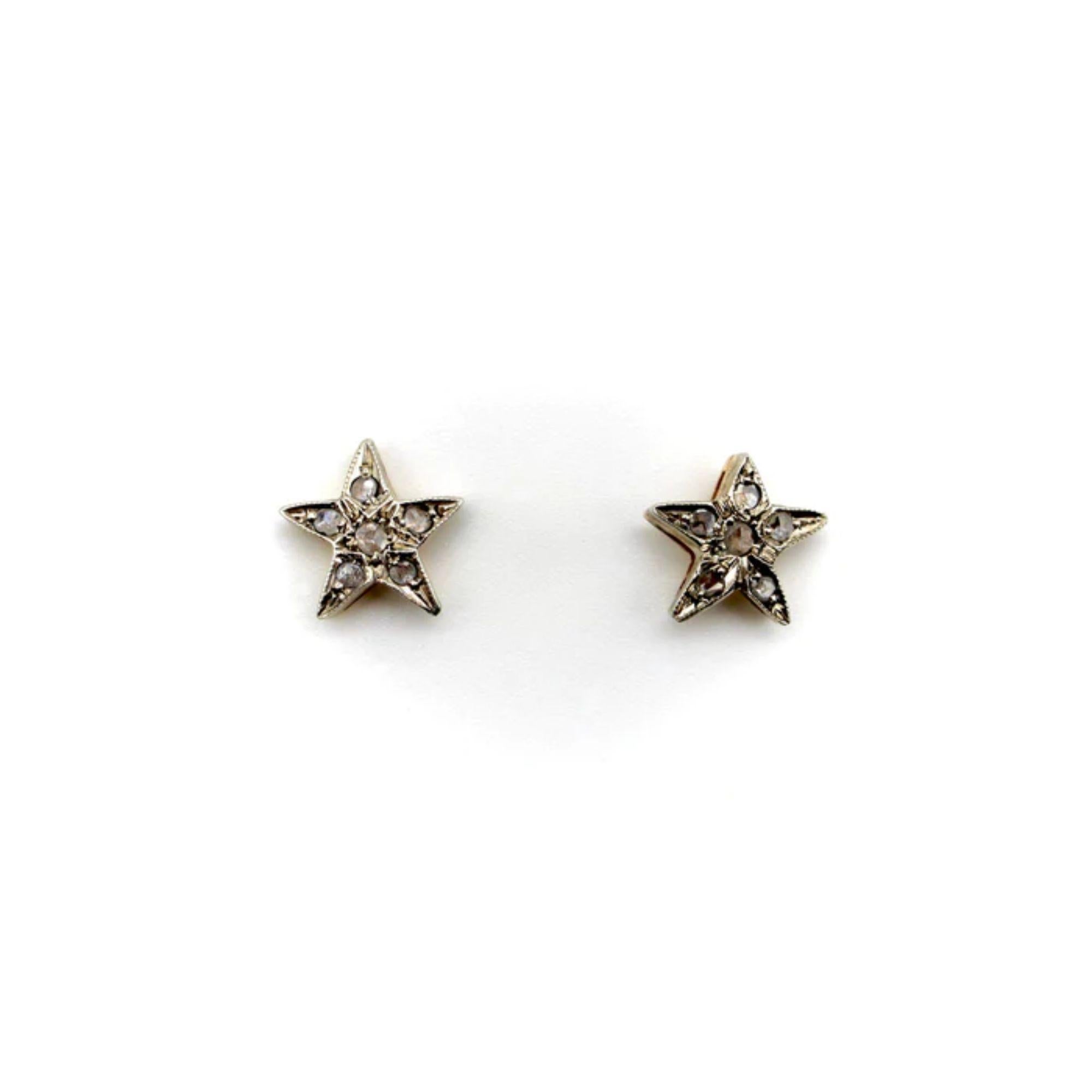 14K Gold and Silver Rose Cut Diamond Star Earrings, circa 1970's or 1980's

These charming little star earrings are slightly asymmetrical, as if they were drawn by hand, or were two starfish found on the beach. Each of the star’s five points are