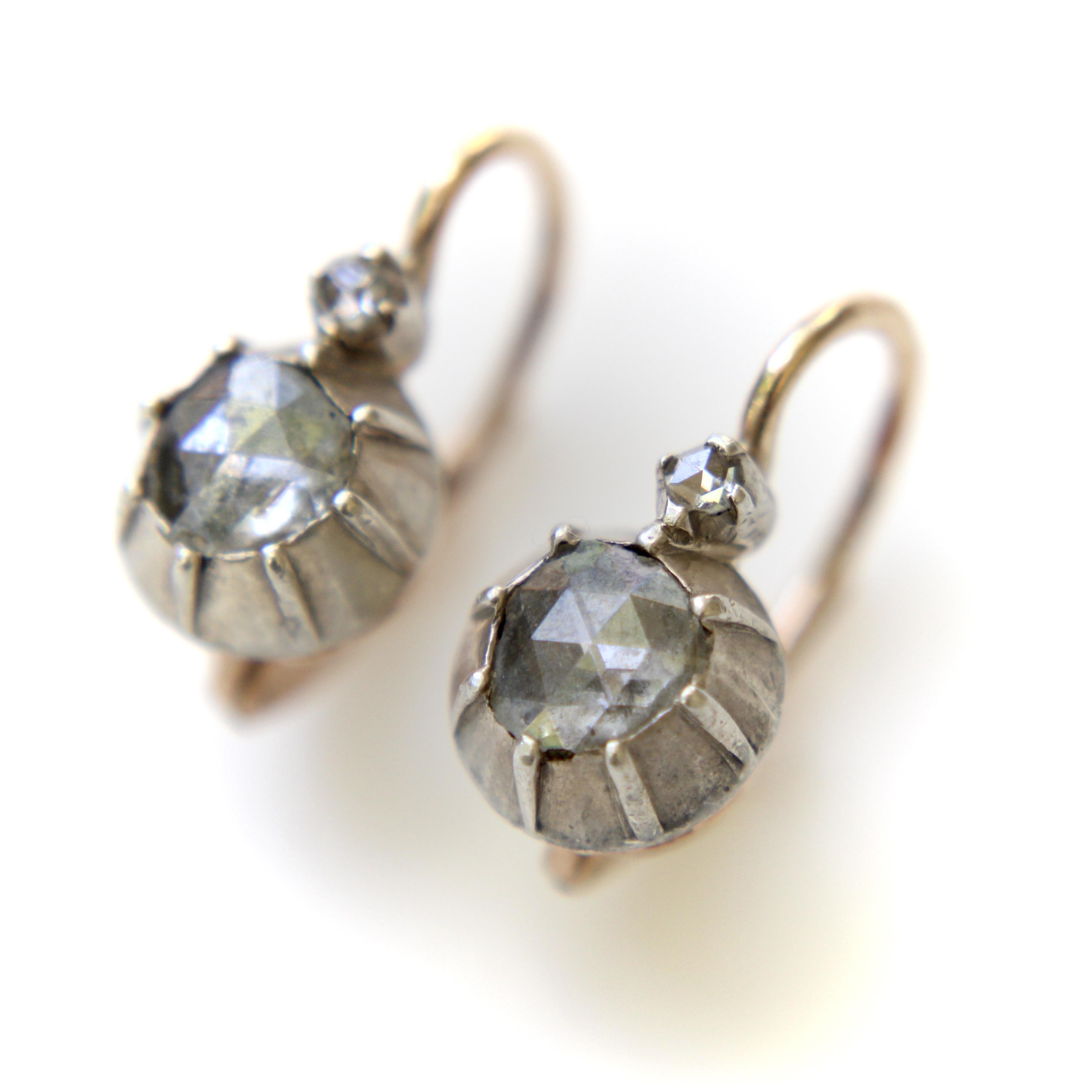 These are a gorgeous pair of Victorian Rose Cut diamond earrings recently sourced in Prague. They bear Austro-Hungarian hallmarks on the wire and feature dutch Rose Cut diamonds that are foil backed. The front of the earrings are set in oxidized