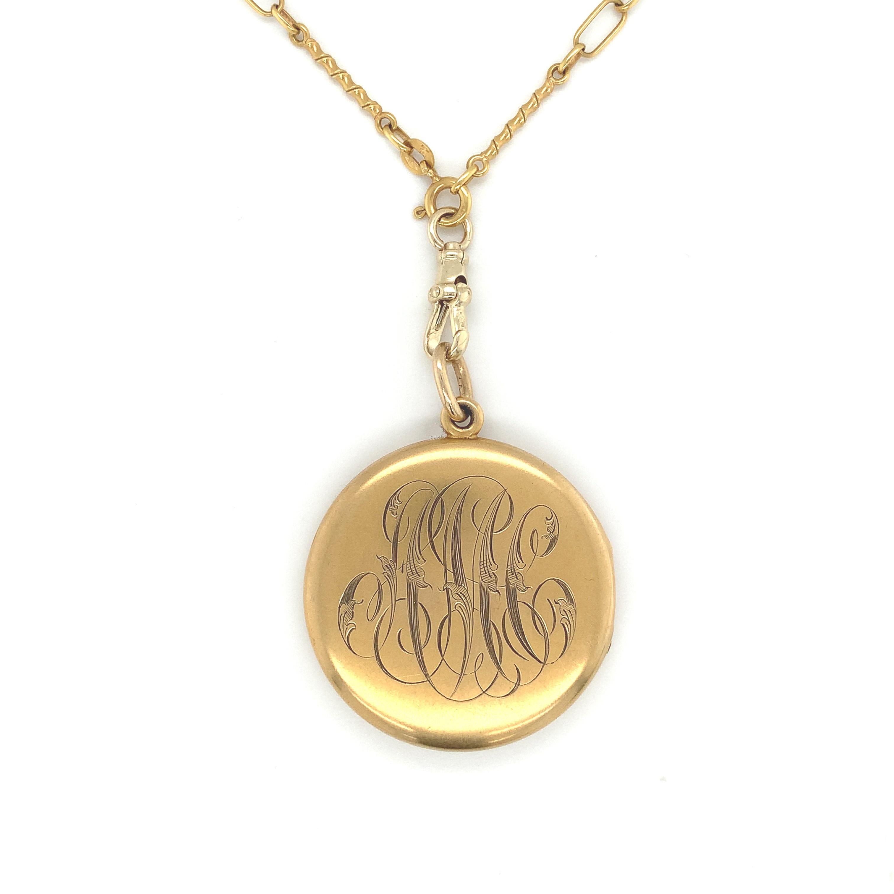 14K yellow gold large round Victorian locket on 18K yellow gold fancy bar link chain. The locket measures 2