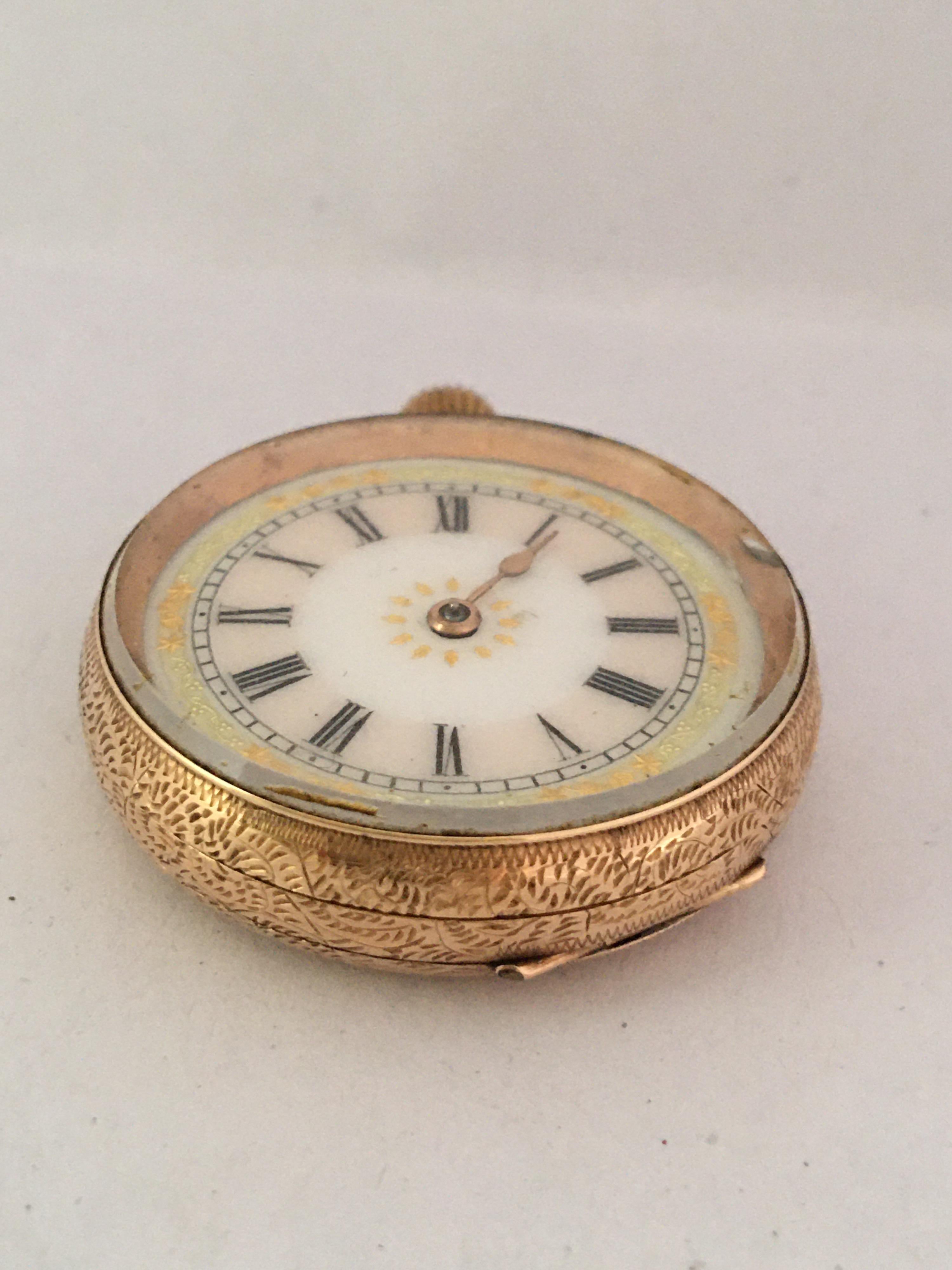 This beautiful 33mm diameter antique mechanical gold ladies watch is in good working condition and it is running well. Visible signs of ageing and wear with light marks on the glass and on the watch case as shown. The minute hand and the metal ring