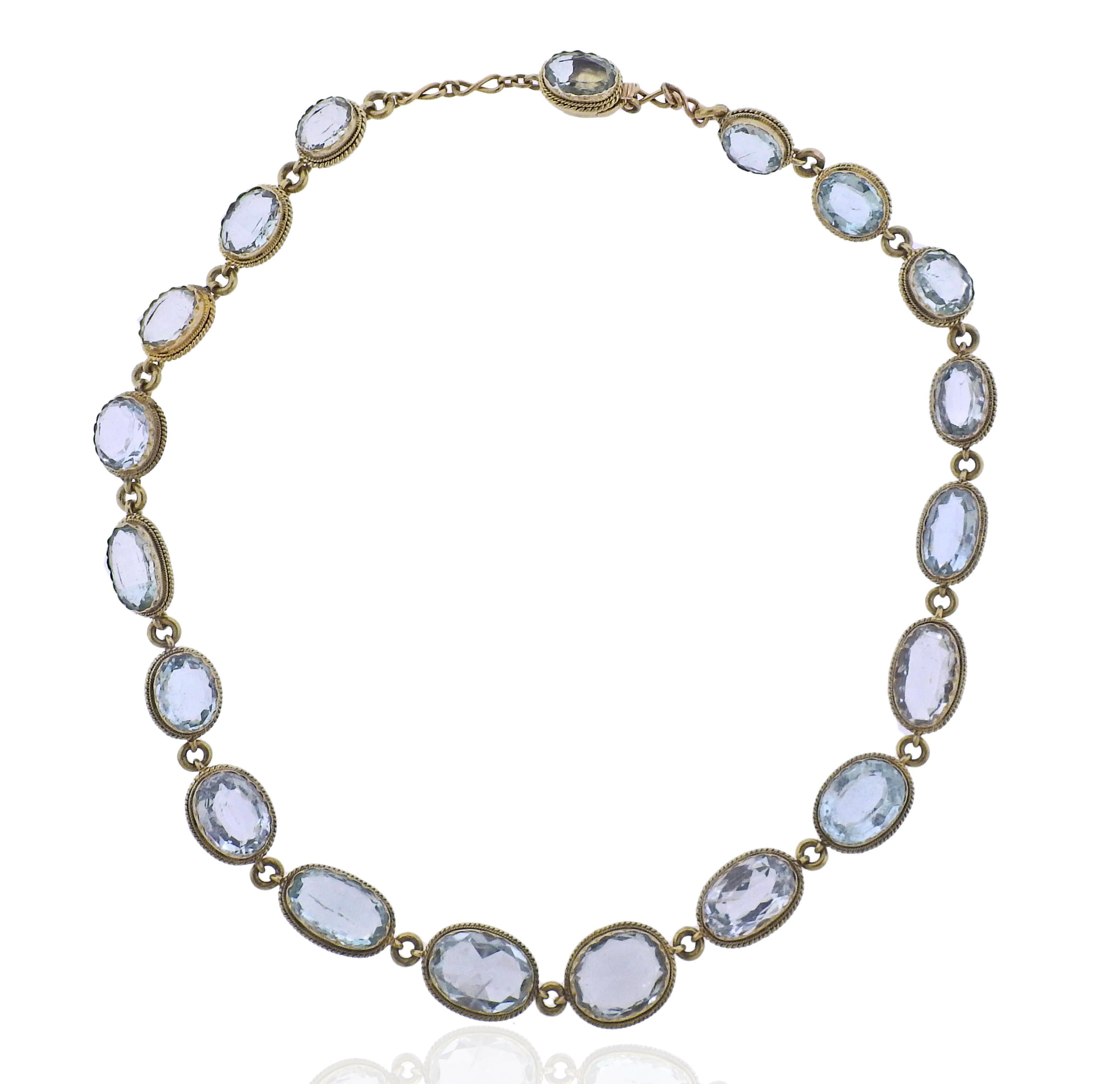 14k gold vintage necklace with aquamarines. Necklace is 15.75