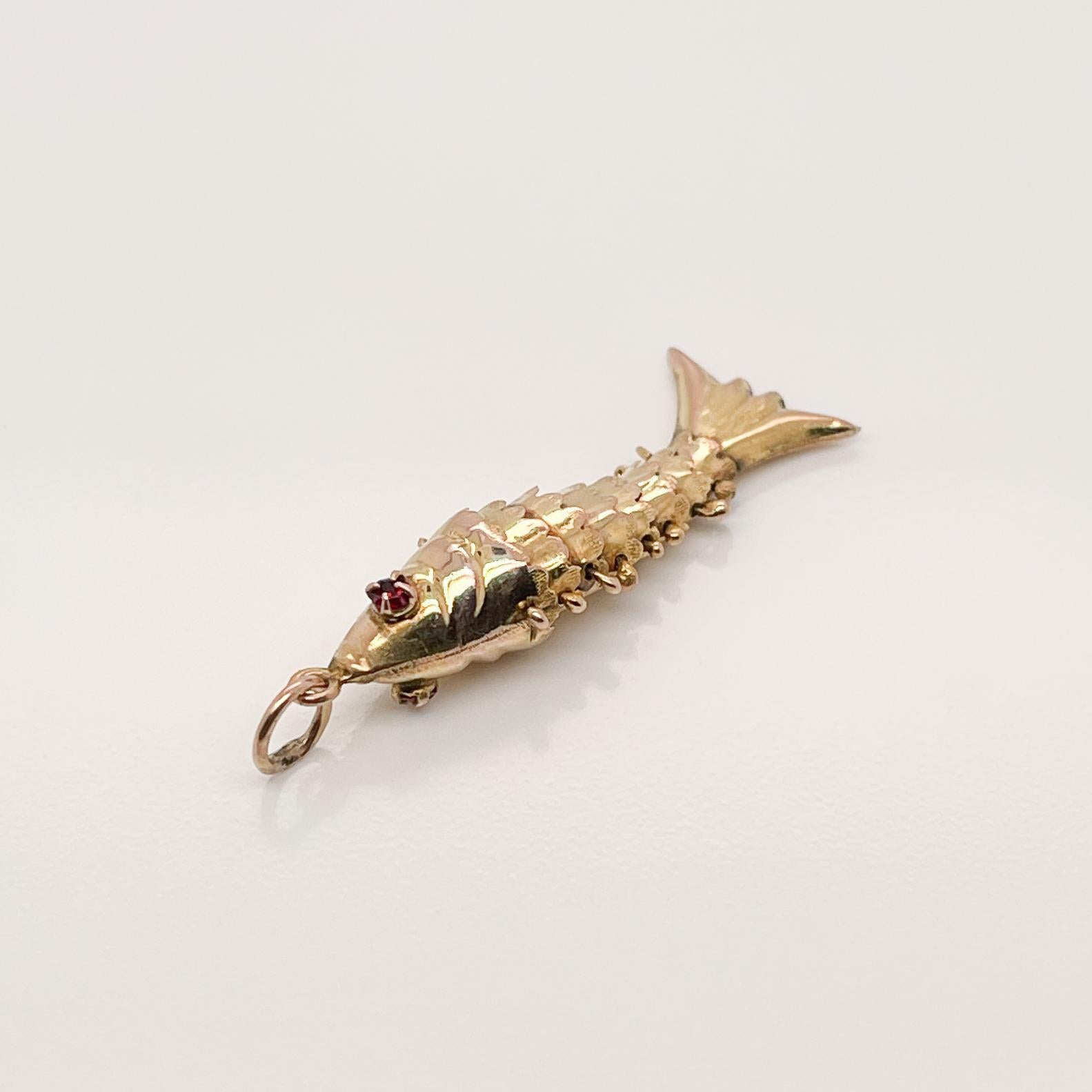 gold articulated fish charm