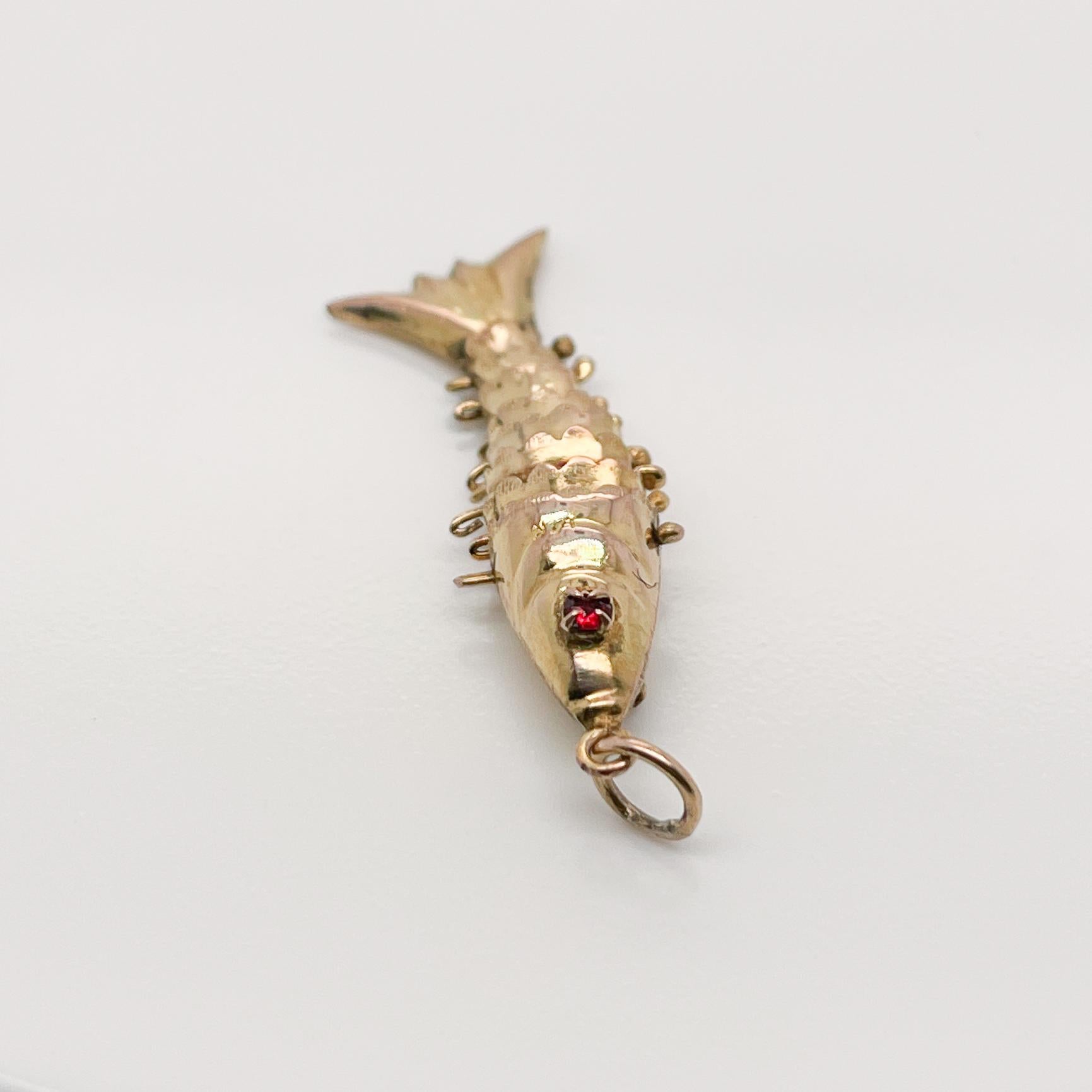 Round Cut 14k Gold Articulated Fish with Garnet Gemstone Eyes Charm for a Bracelet