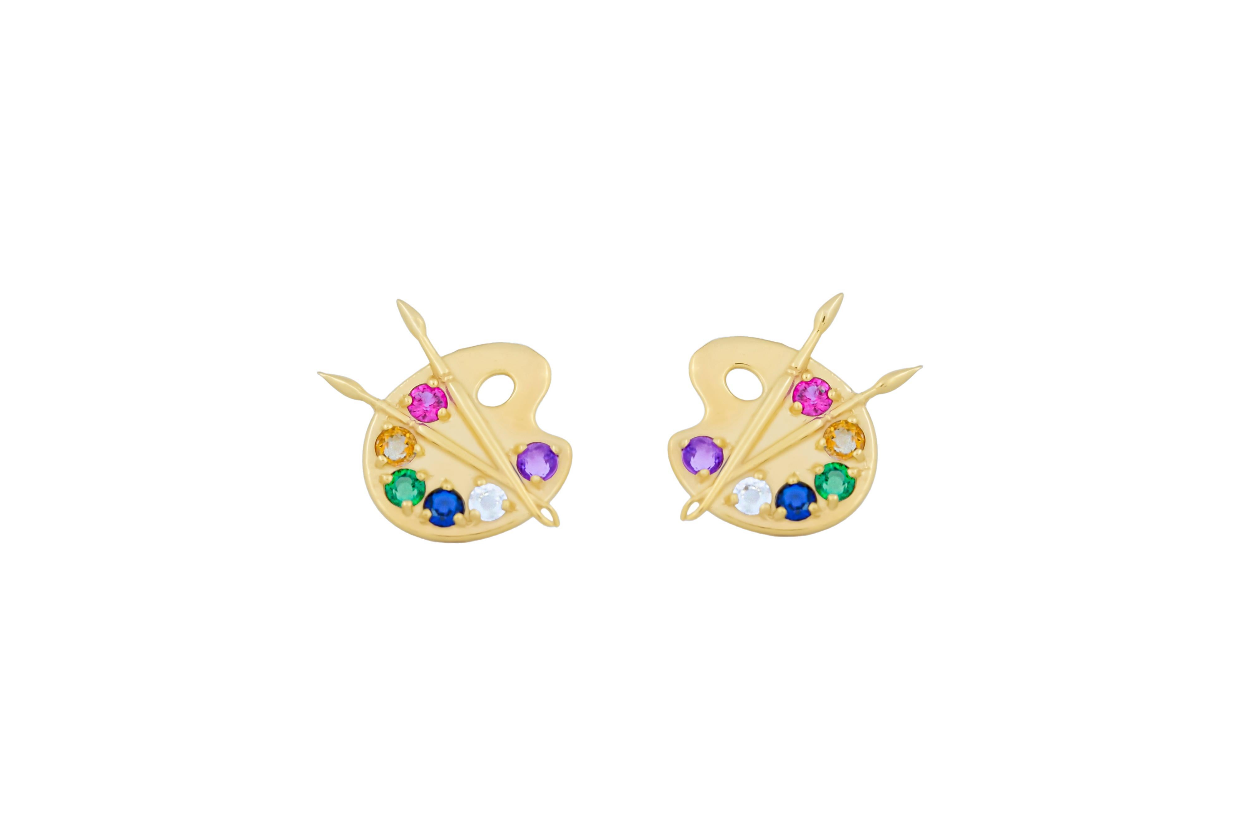 14k Gold Artist Palette Earrings studs.
Multicolor gemstones earrings. Paint Palette and Brush Earrings. Artist Studs. Painter Studs.

Metal: 14k gold
14x16 mm size
Weight 2.5 gr.

Gemstones:
Amethyst, sapphires, garnet, emeralds - 12 stones:
round