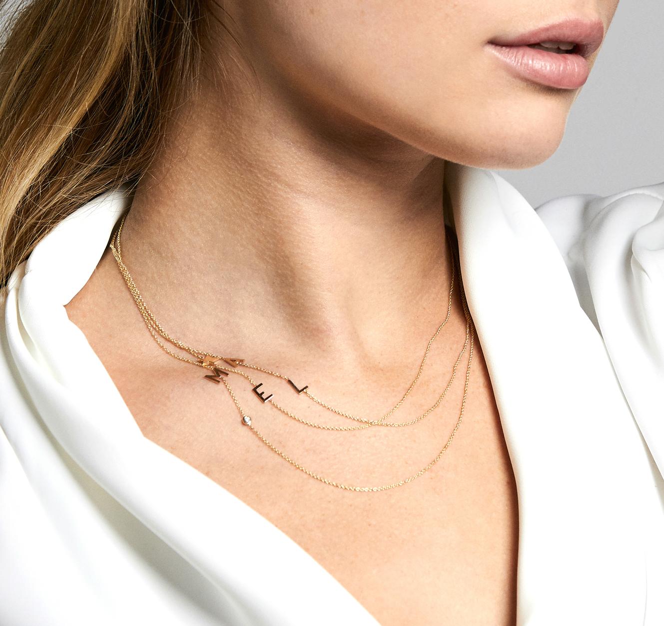 Timeless 14k solid gold asymmetrical initial on a dainty cable link chain necklace, available in 14k yellow gold. It makes for the perfect necklace with a modern twist having the initial laying sideways, wear it with your initial or your loved