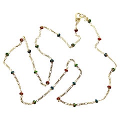 Cadena de eslabones Figaro de oro de 14 quilates con cuentas de oro esmaltadas de colores
