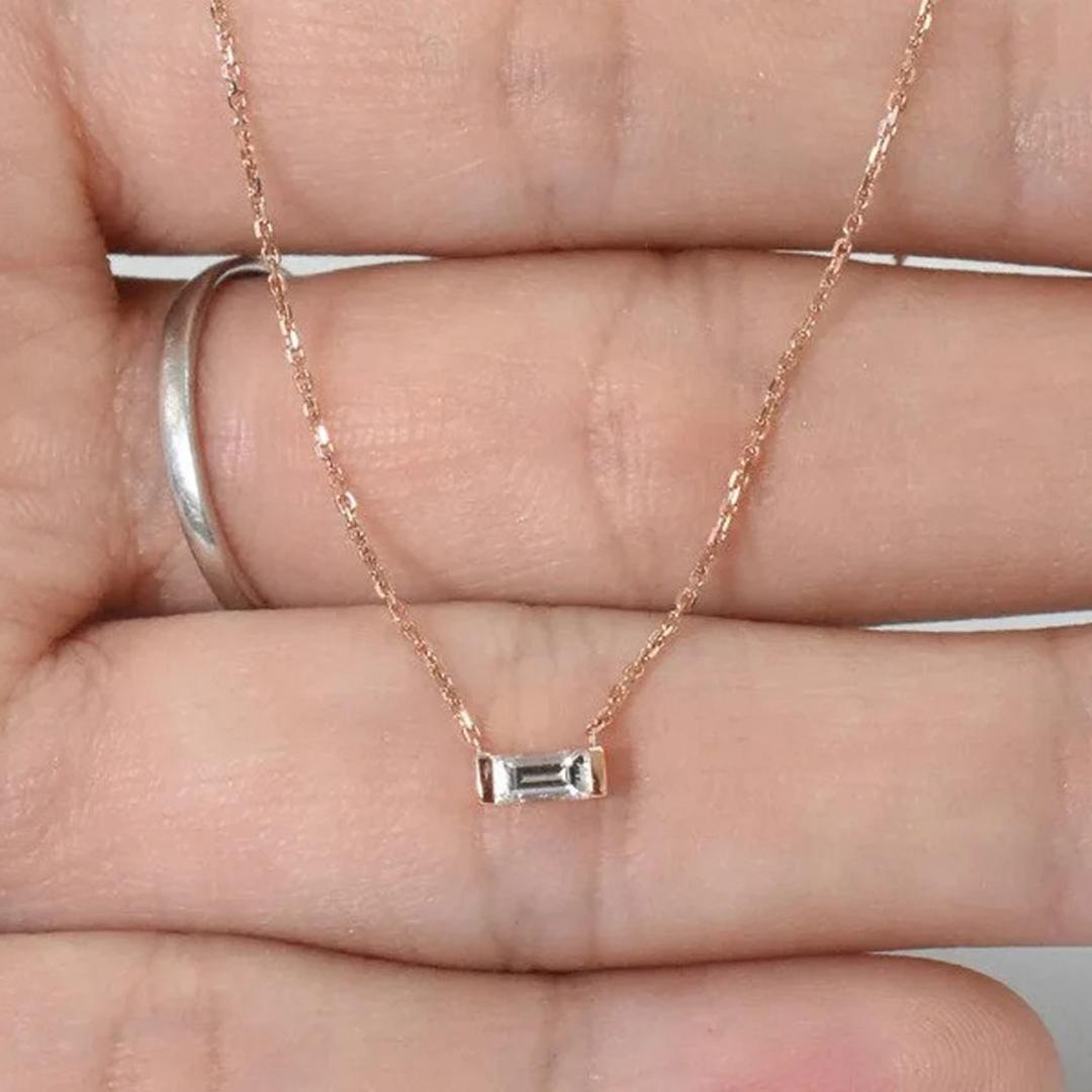 Baguette Diamond Necklace made of 14k solid gold available in three colors of gold, Yellow Gold / White Gold / Rose Gold.

This beautiful minimalist necklace is a terrific way to add an elegant glittering touch to any outfit. this is made with 14k