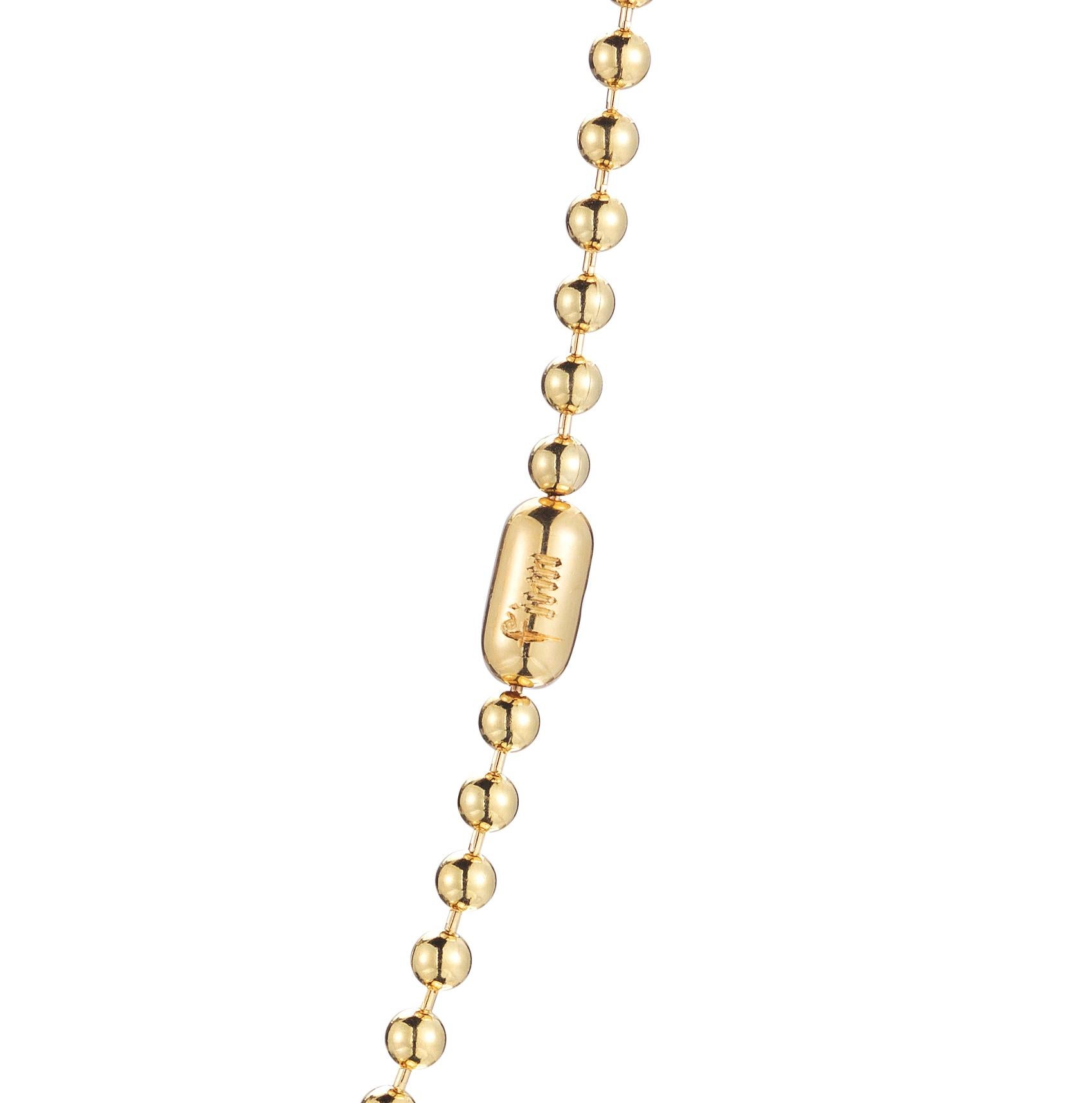 This isn't the ball chain jewelry you remember. Here is a grown up version in solid gold. The best part is the traditional capsule closure with a hand engraved 