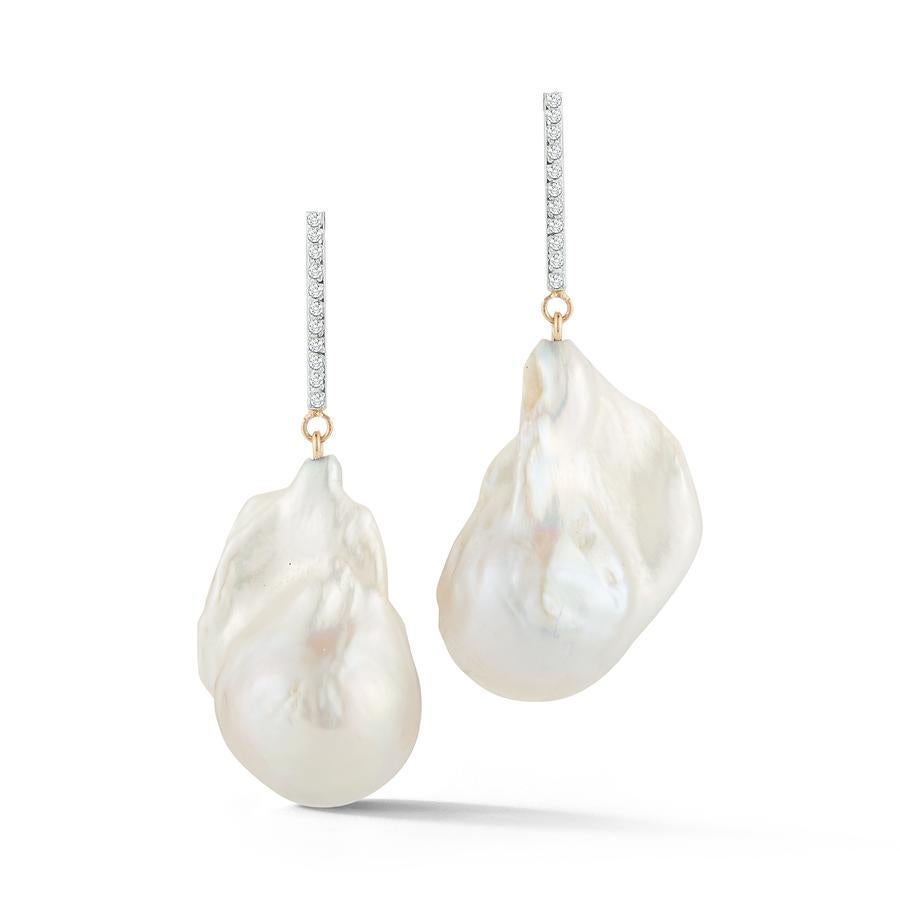 Beautifully handcrafted in New York with 14K Gold and Baroque Pearls. Each magnificent pearl is selected for its beauty, shape and luster.  Like a puff of cloud the baroque pearl is set with a 14kt yellow gold bars hand set with brilliant diamonds. 